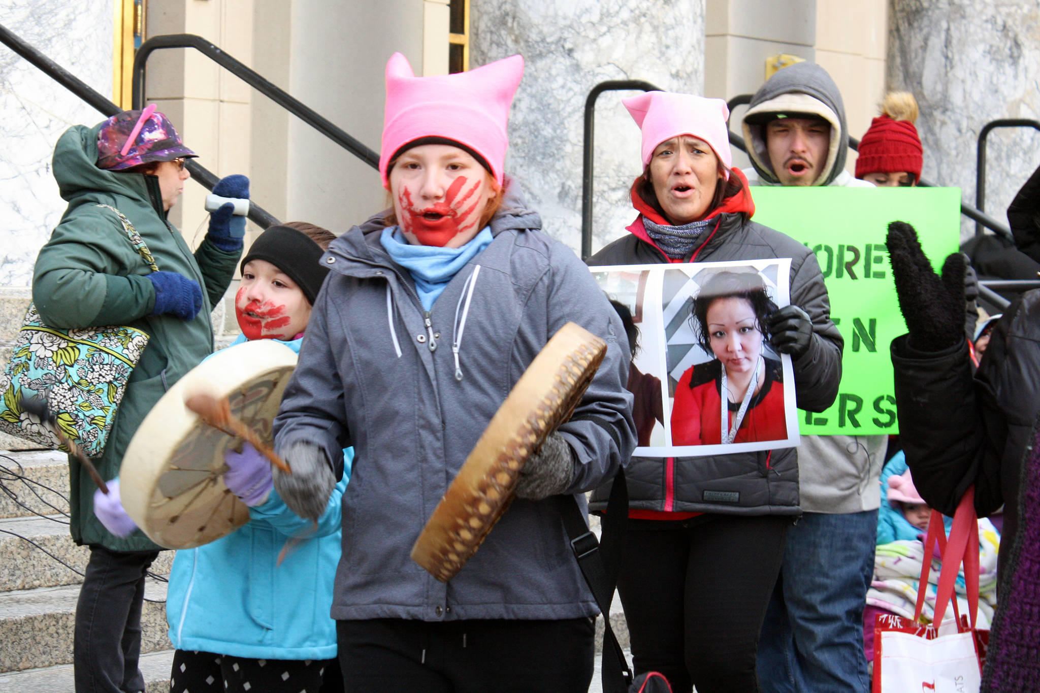 Aaliyah Cropley, 12, beats her drum and leads marchers away from the Alaska State Capitol and toward Centennial Hall at the 2020 Womens March, Saturday Jan. 18. (Ben Hohenstatt | Juneau Empire)