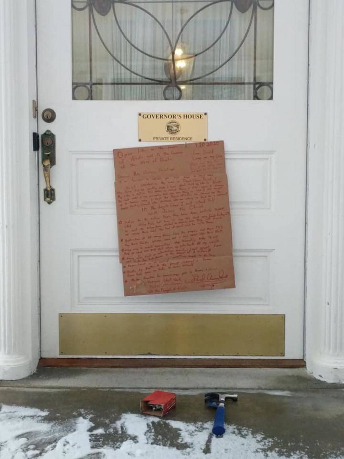 The sign nailed to the Governor’s Mansion by a man on Jan. 20, 2020. (Courtesy Photo)