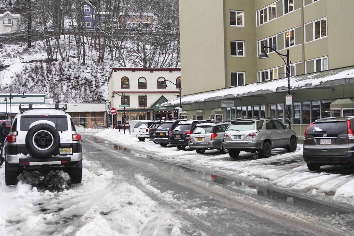 Rising temperatures have filled the streets with slush as rain melts the snow and ice on Tuesday. (Michael S. Lockett | Juneau Empire)