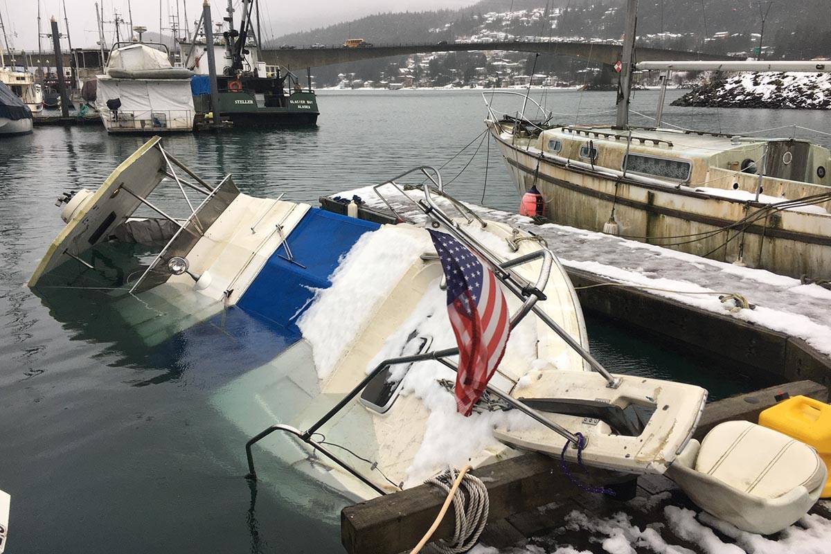 A submerged boat at Harris Harbor activated an automatic emergency beacon, triggering a search and rescue deployment from local Coast Guard units on Jan. 23, 2020. (Michael S. Lockett | Juneau Empire)