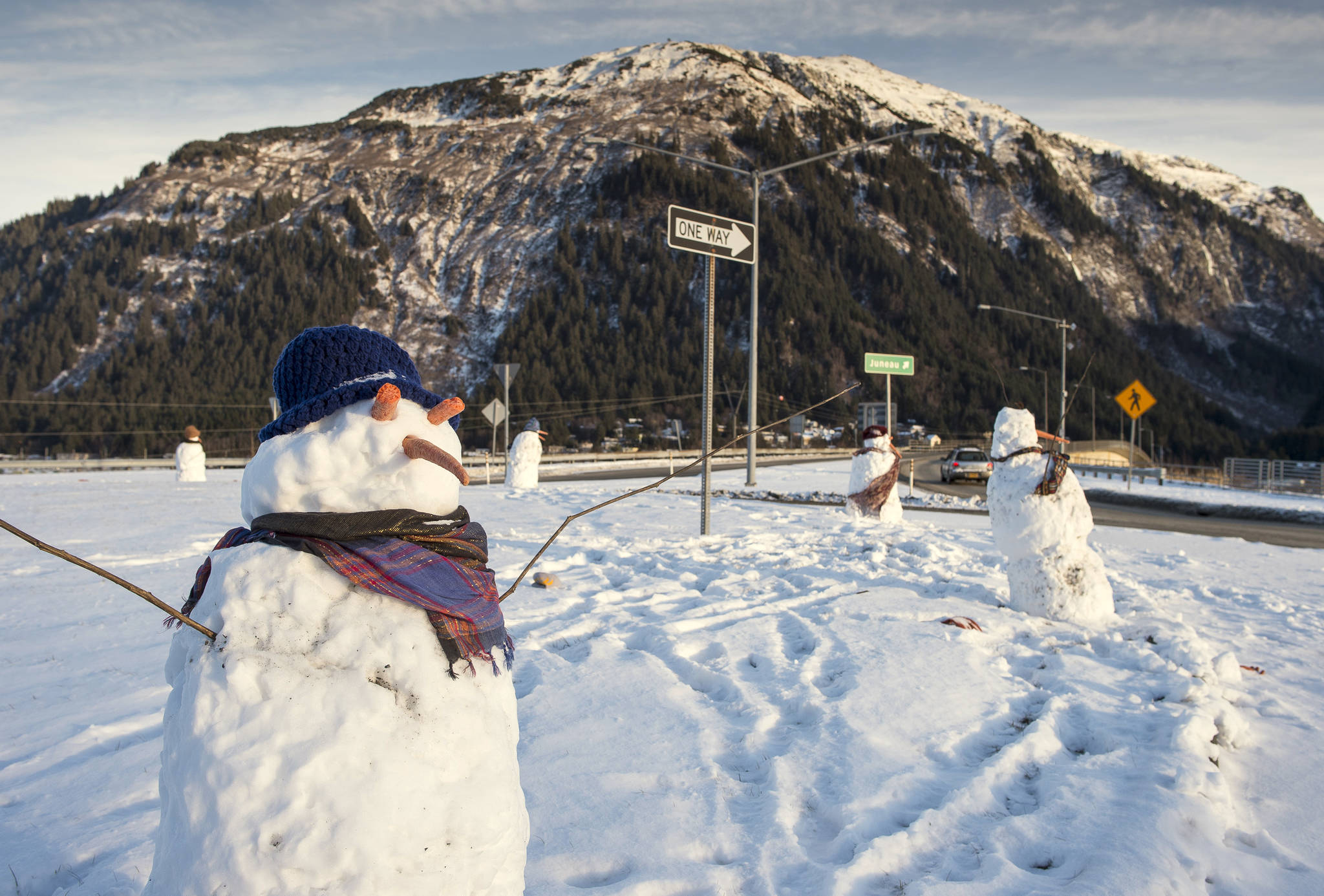 Snowmen that showed up in the Douglas roundabout. (Michael Penn | Juneau Empire File)