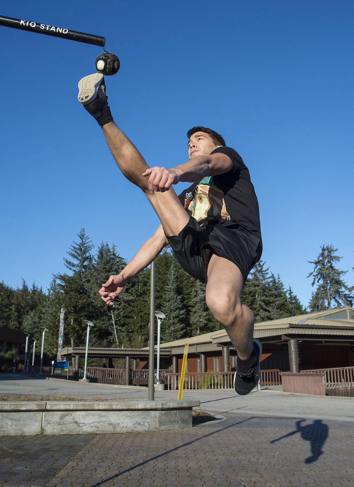 Kyle Worl demonstrates the one-foot high kick while at the University of Alaska Southeast campus on Tuesday, Nov. 7, 2017. (Michael Penn| Juneau Empire File)