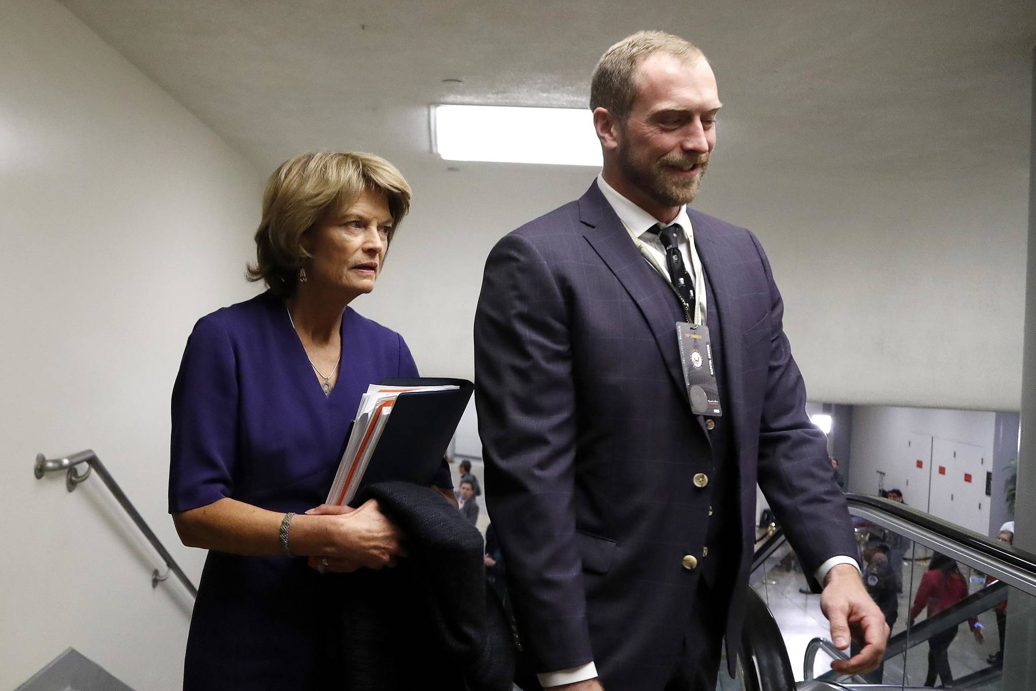 Sen. Lisa Murkowski, R-Alaska, left, arrives on Capitol Hill in Washington, Thursday during the impeachment trial of President Donald Trump on charges of abuse of power and obstruction of Congress. (AP Photo | Julio Cortez)