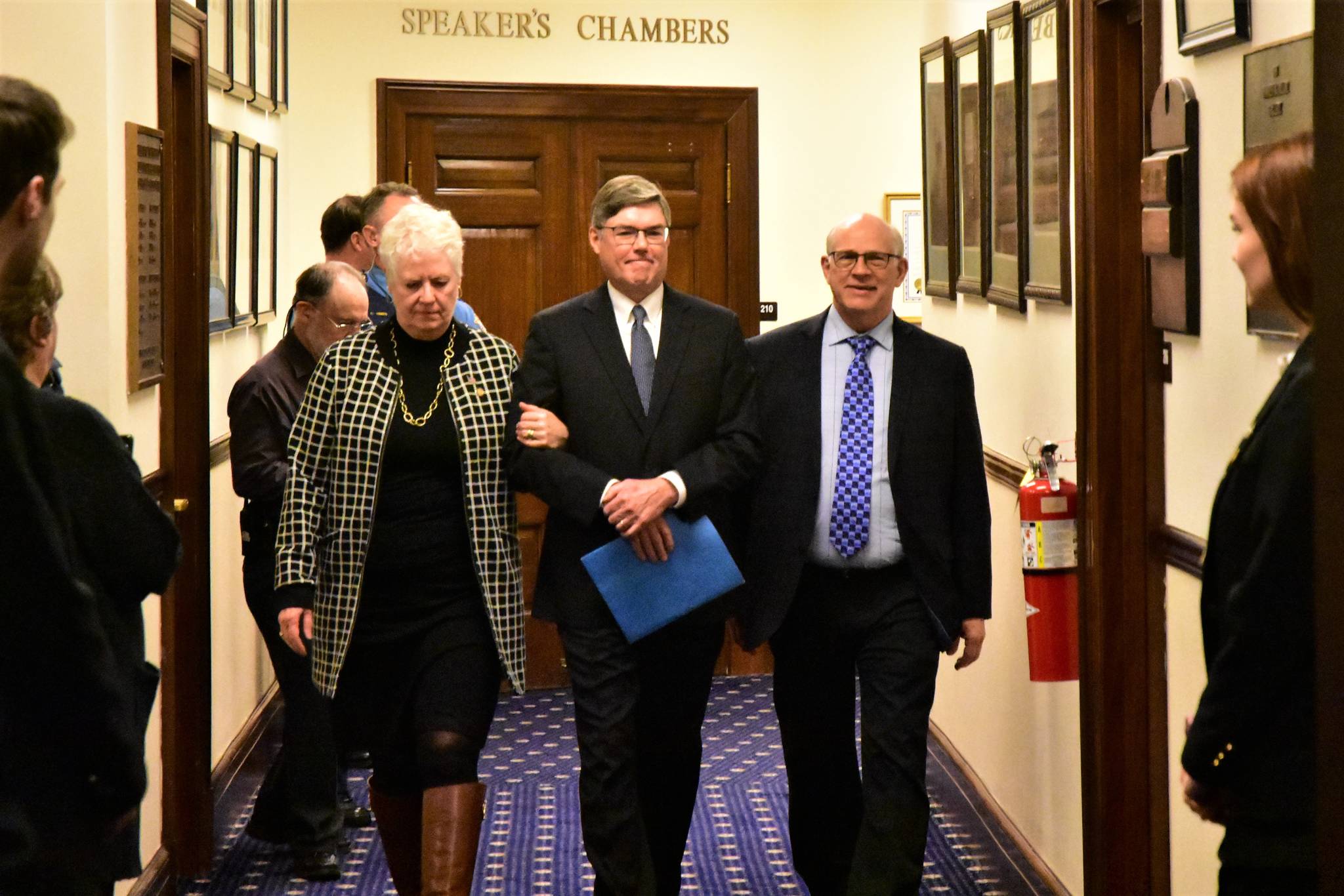Alaska Supreme Court Chief Justice Joel M. Bolger, center is escorted into the House Chamber by Rep. Louise Stutes, R-Kodiak, and Sen. John Coghill, R-North Pole, on Wednesday, Feb. 12, 2020. (Peter Segall | Juneau Empire)
