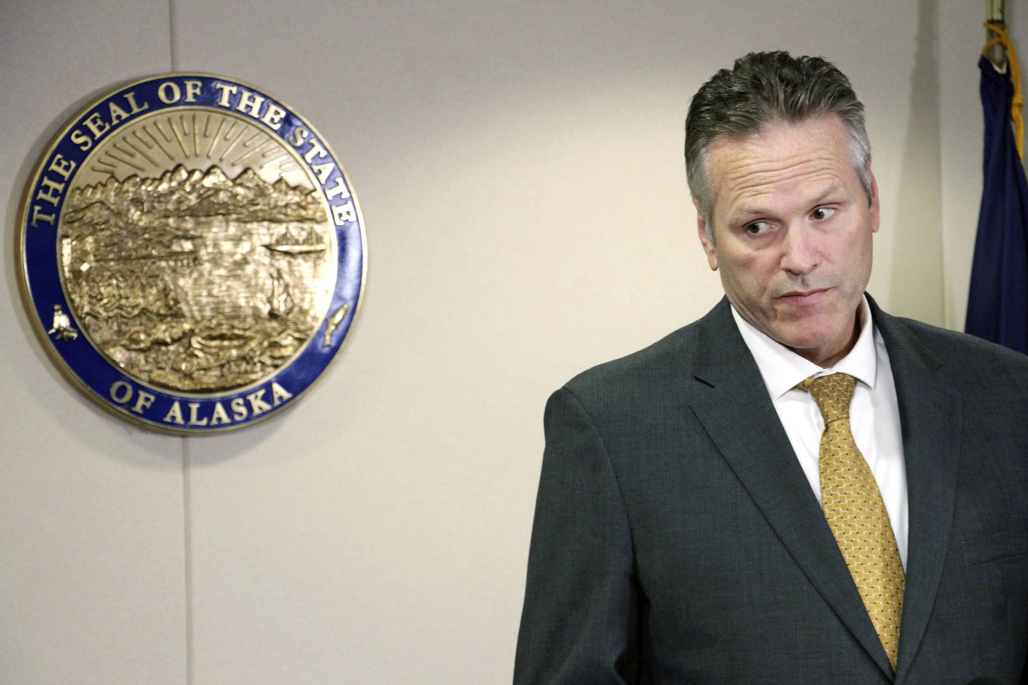 In this Sept. 26 file photo, Gov. Mike Dunleavy listens during a news conference in Anchorage. (AP Photo | Mark Thiessen)