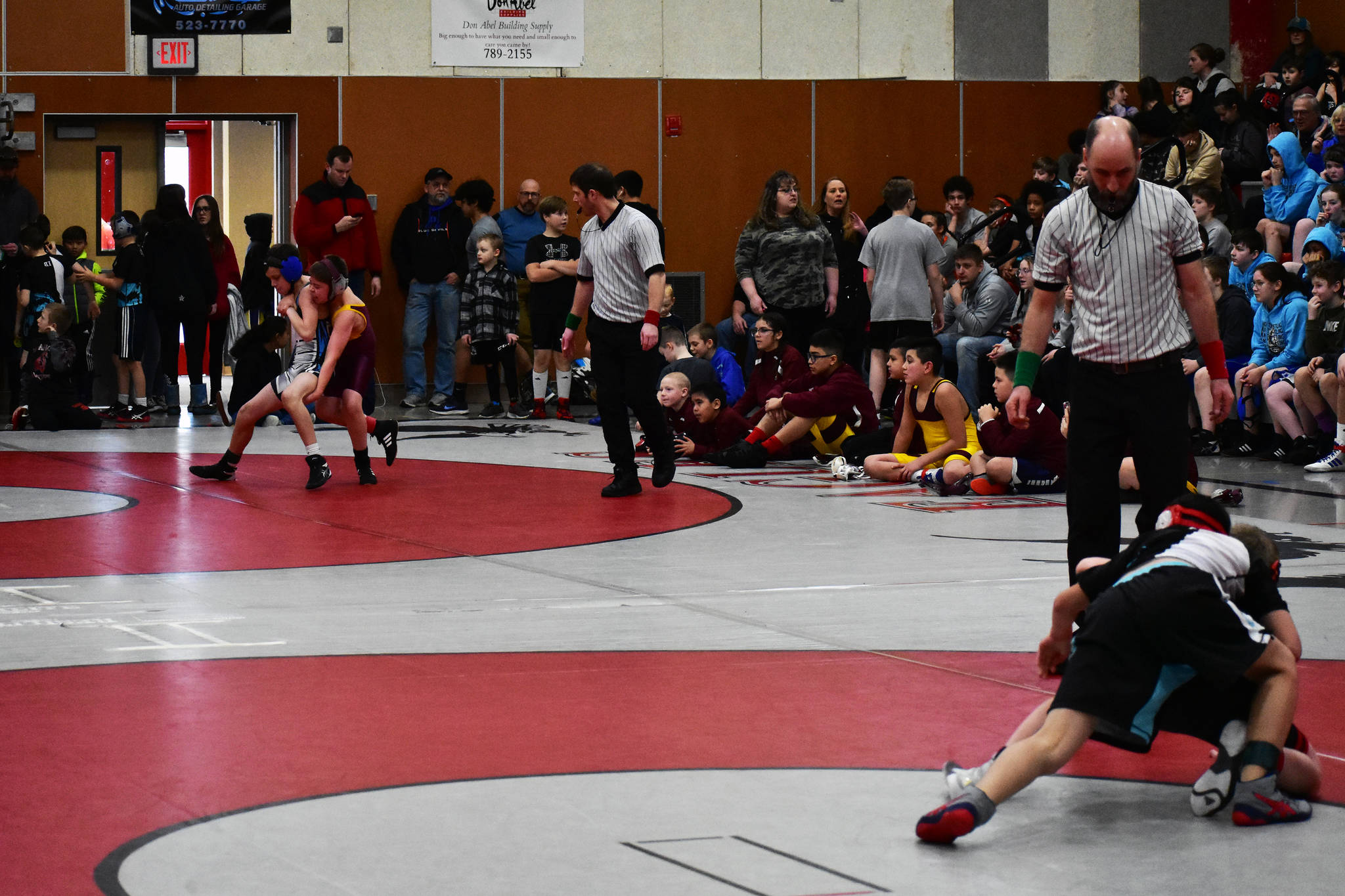 Matches were being held two at a time during the 2020 Southeast Alaska Middle School Wrestling Championship at Floyd Dryden Middle School on Friday. (Peter Segall | Juneau Empire)