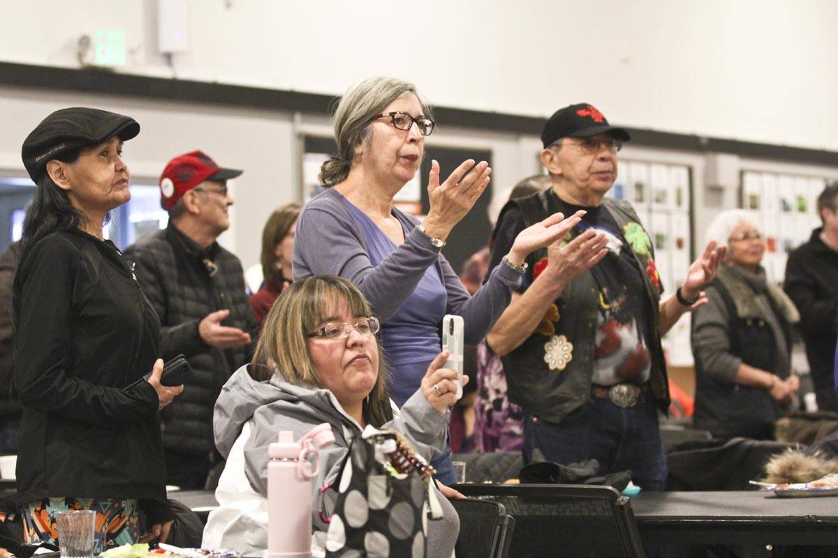Members of the crowd stand in recognition of Elizabeth Peratrovich during the Elizabeth Peratrovich Day celebration at the Tlingit and Haida Community Council on Sunday. (Michael S. Lockett | Juneau Empire)