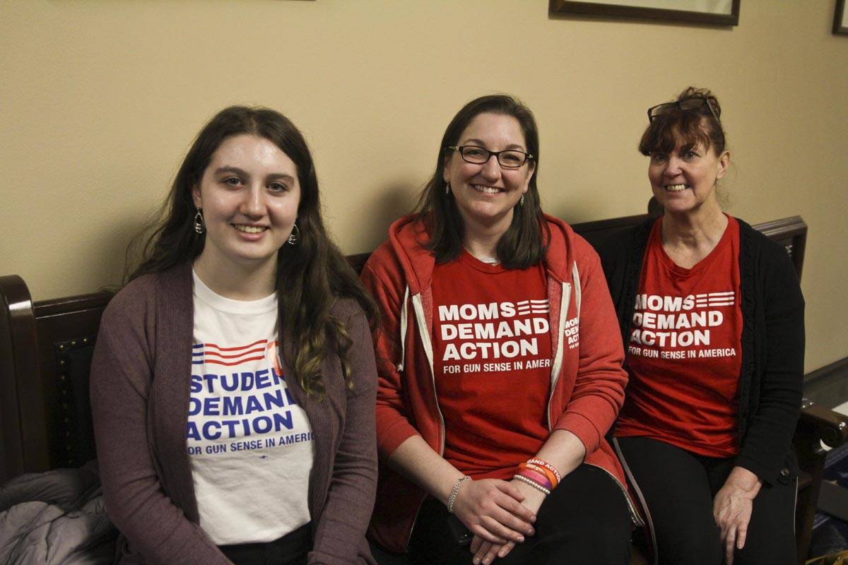 Portia Carney, Justina Sullivan, and Pearl Temple pose in the Capitol before soliciting lawmakers for their support of House Bill 62, or the ability to temporarily take guns away from people who have made threats or are having a mental health crisis. (Michael S. Lockett | Juneau Empire)