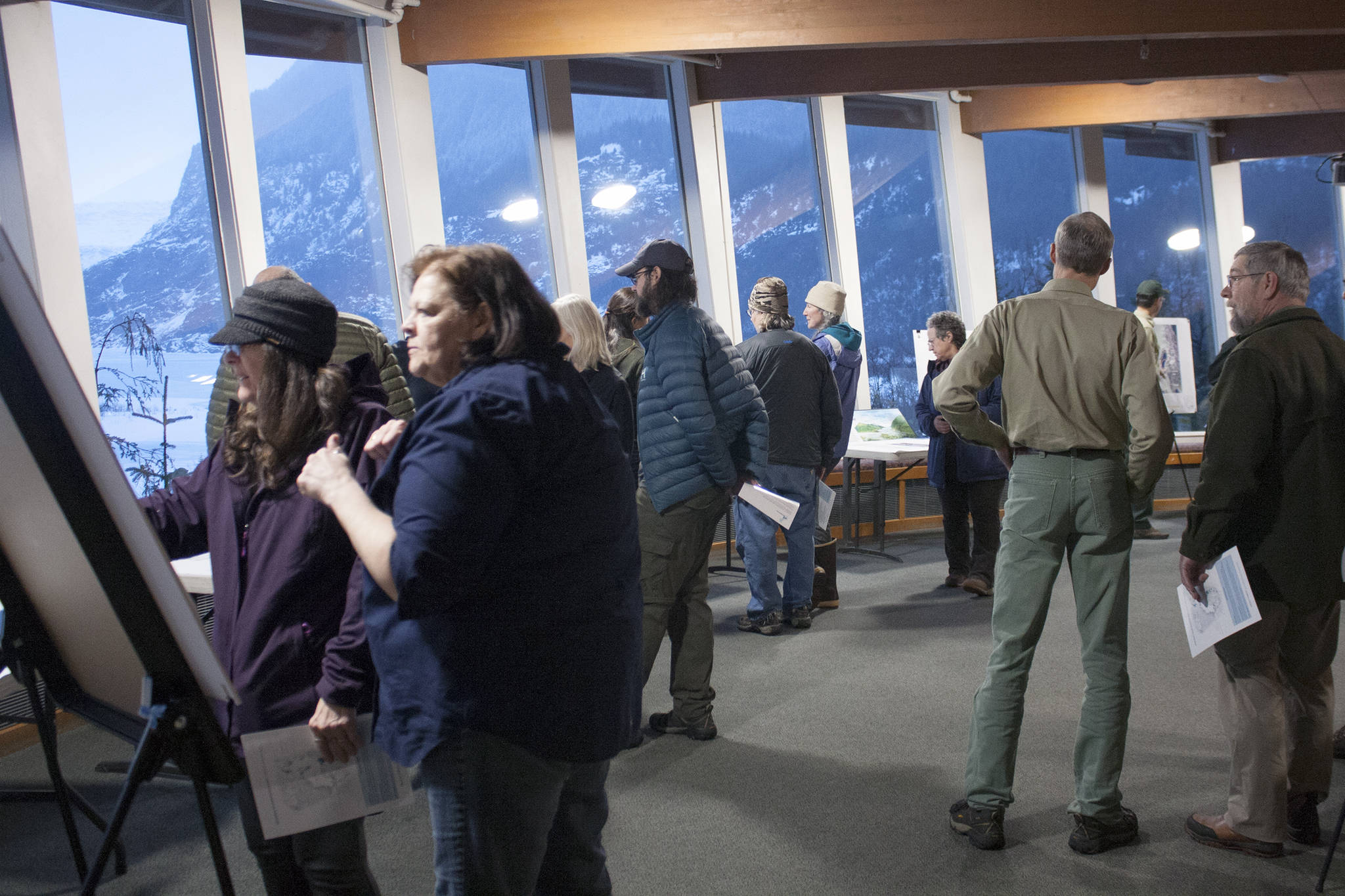 Despite howling winds and plenty of slush, dozens of people attended a scoping open house Thursday at the Mendenhall Glacier Visitor Center. (Ben Hohenstatt | Juneau Empire)