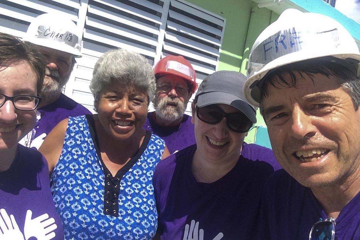 Volunteers with All Hands and Hearts, including Fred Hiltner, far right, take a photo with a homeowner they were helping in Puerto Rico following Hurricane Maria in March 2018. (Courtesy Photo | Fred Hiltner)