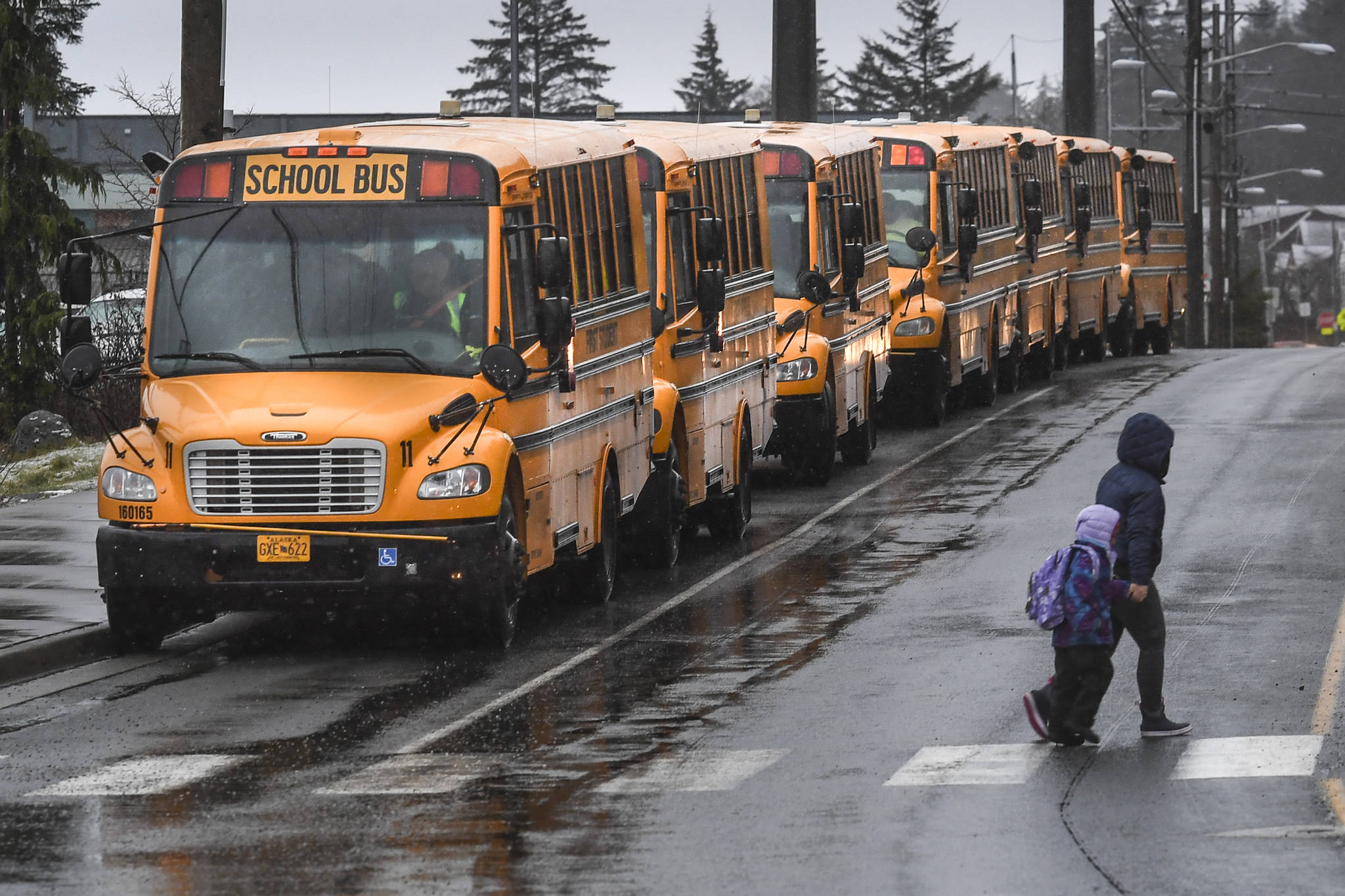 Michael Penn | Juneau Empire File                                School buses line up for students at Harborview Elementary School in December 2019.