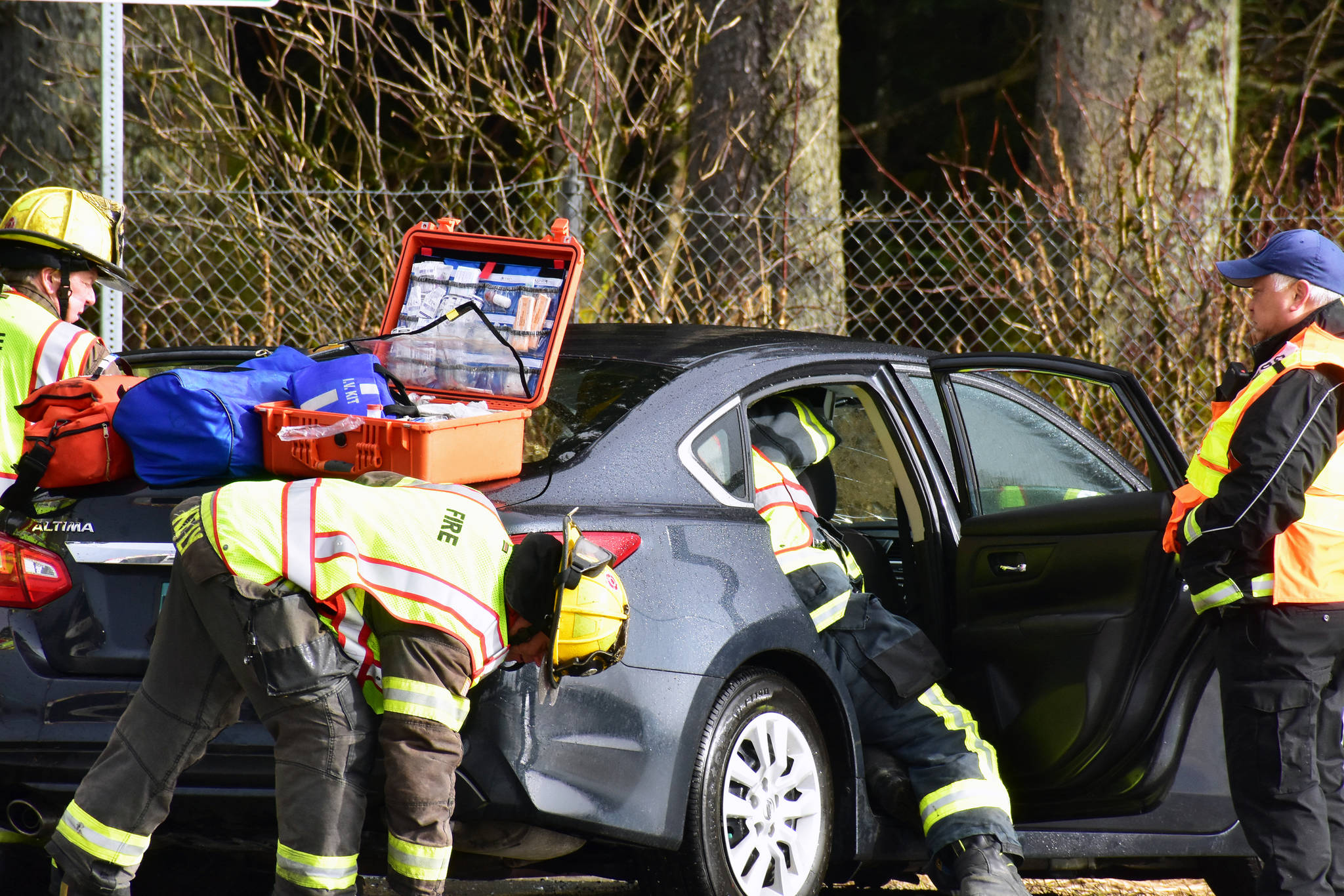 Capitol City Fire/Rescue respond to a car crash at the intersection of Egan Drive and Glacier Highway on Thursday, Feb. 27, 2020. (Peter Segall | Juneau Empire)