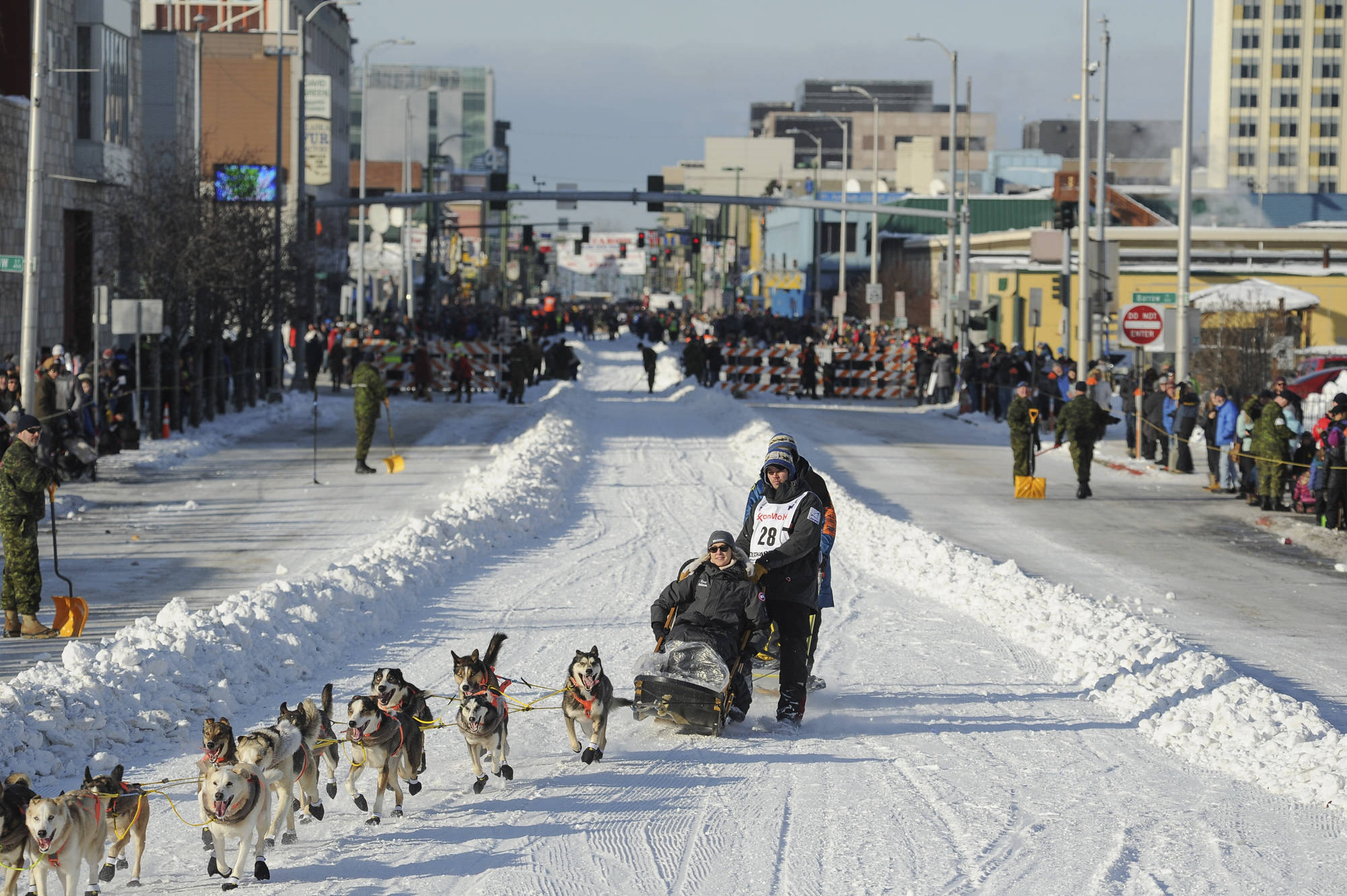 Defending champion Joar Lefseth Ulsom runs his team down Fourth Ave during the ceremonial start of the Iditarod Trail Sled Dog Race in Anchorage. Alaska Airlines announced Monday, March 2, 2020, it will drop its sponsorship of the Iditarod, Alaska’s most famous sporting event. The airline in a statement said the decision was made as it transitions to a new corporate giving strategy, but People for the Ethical Treatment of Animals, the most vocal critic of the thousand-mile sled dog race across Alaska, immediately took credit. (AP Photo/Michael Dinneen, File)