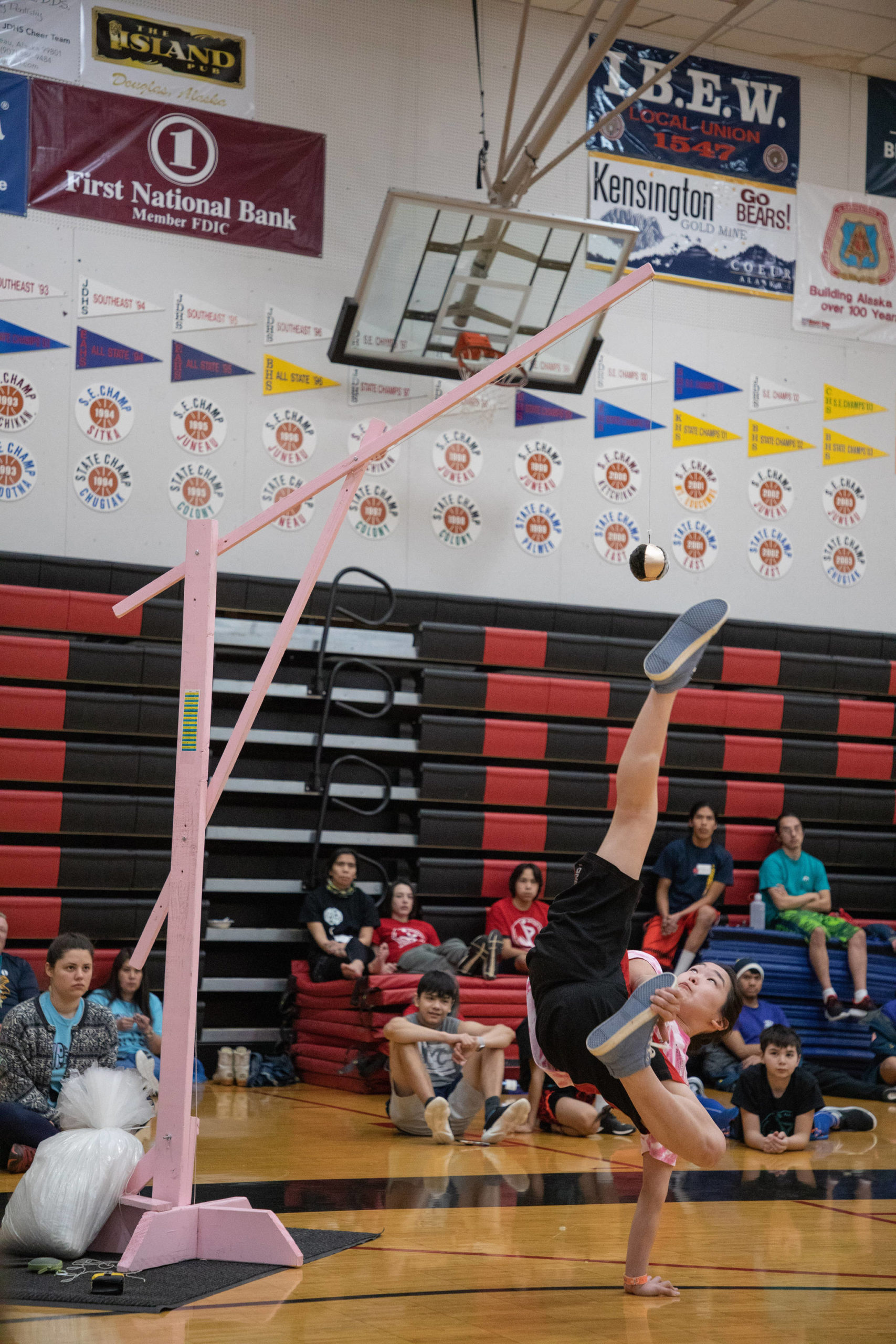 An athlete competes in the Alaskan high kick at the 2020 Traditional Games held Saturday and Sunday at Juneau-Douglas High School: Yadaa.at Kalé. The games attracted teams from throughout Alaska, international competitors and collegiate teams from Alaska Pacific University and Northern Arizona University. (Courtesy Photo | Lyndsey Brollini, courtesy of Sealaska Heritage Institute)