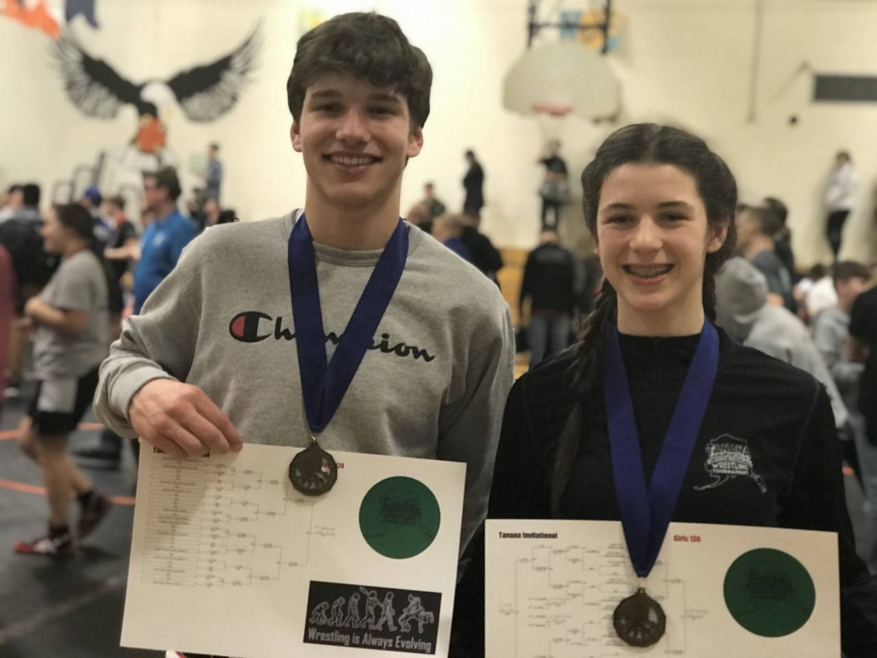 Left: Thomas Baxter, 174 pounds, and Evelyn Richard, 136 pounds, each won their divisions at the Middle School State Wrestling Championship in Fairbanks.