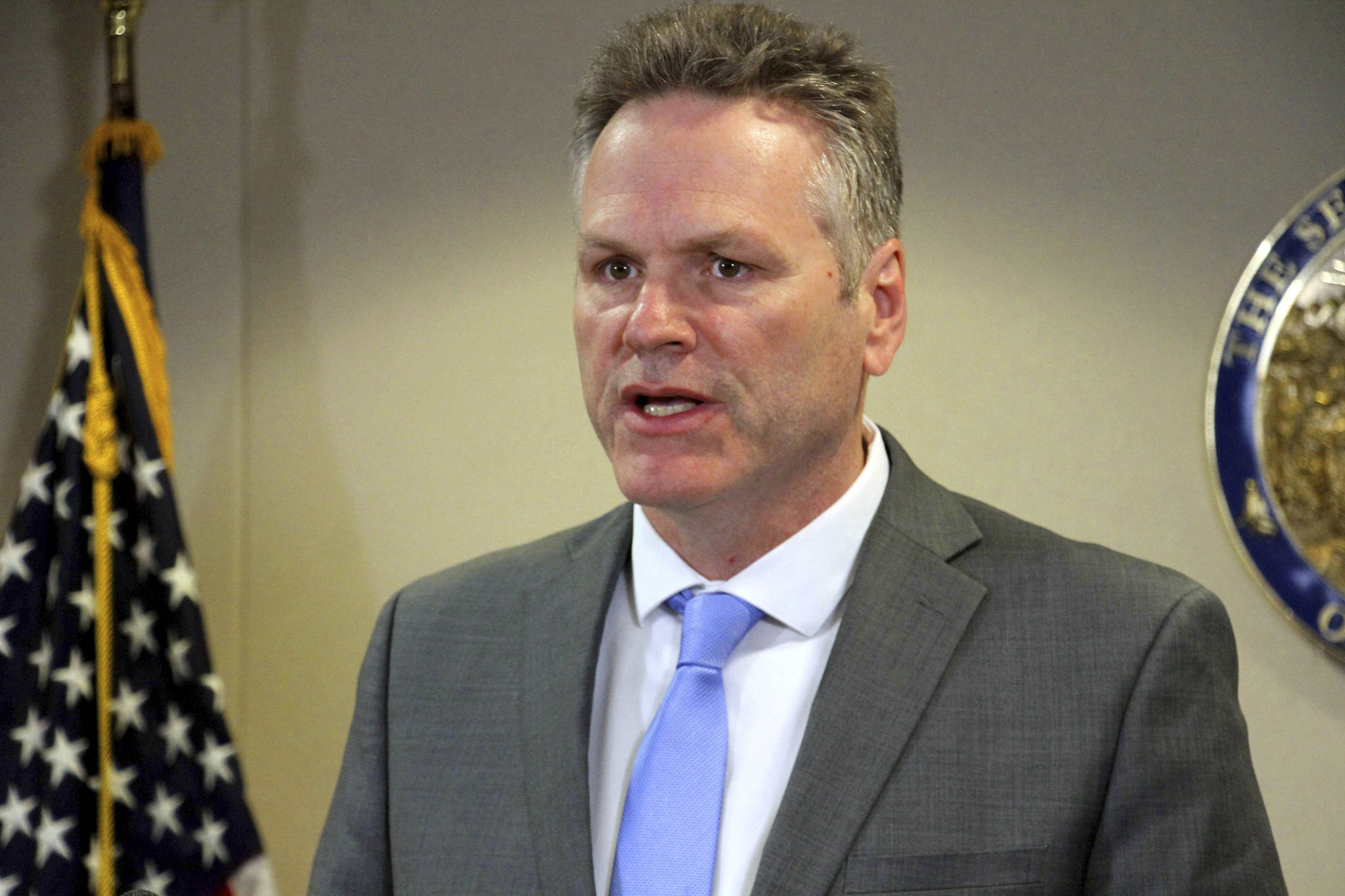 Alaska Gov. Mike Dunleavy addresses reporters at a news conference Monday, March 9, 2020, in Anchorage, Alaska. State officials said 23 people have been tested for the new coronavirus with no positive results. (AP Photo/Mark Thiessen)