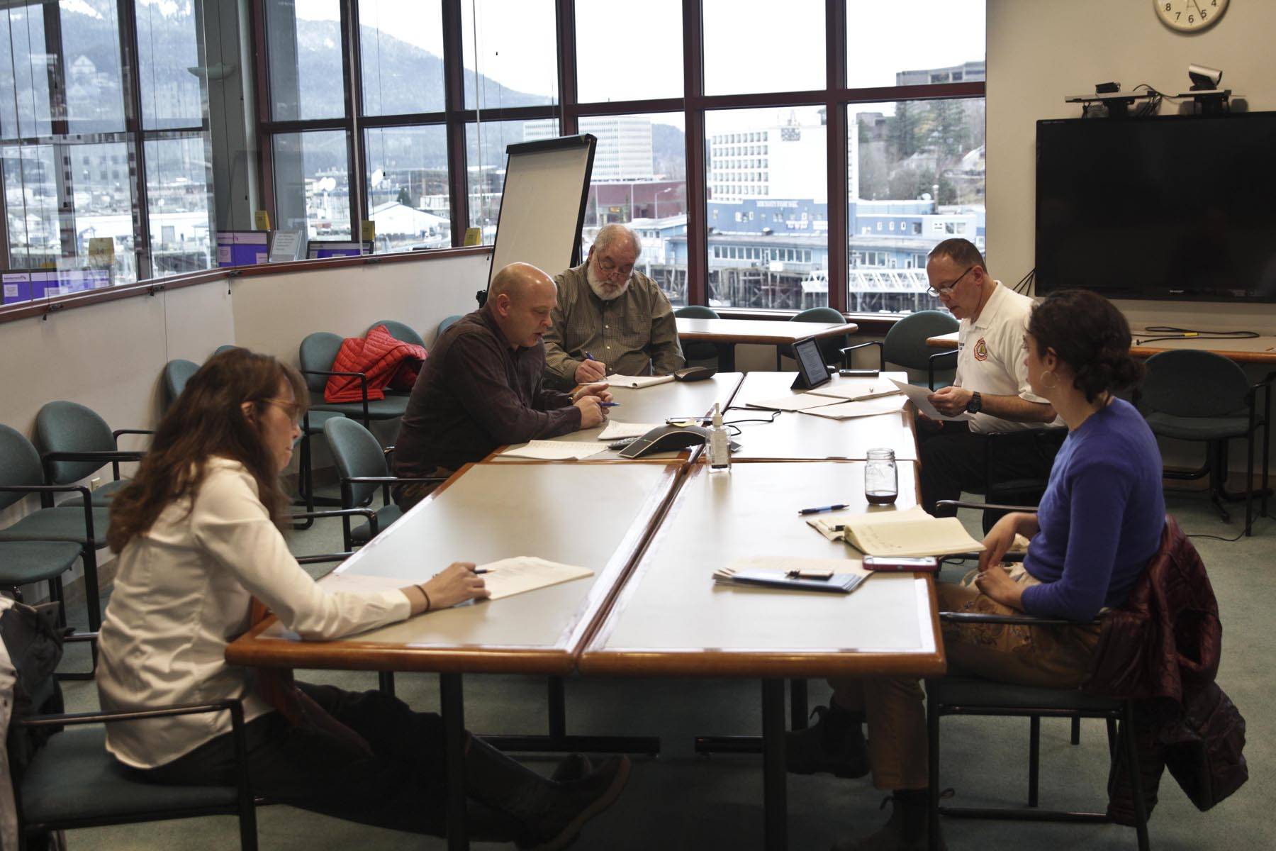 Government officials from the City and Borough of Juneau, medical professionals, and personnel from various shelters and nonprofits meet to discuss Juneau’s plan for preventing the spread of the coronavirus among Juneau citizens experiencing homelessness on March 18, 2020. (Michael S. Lockett | Juneau Empire)