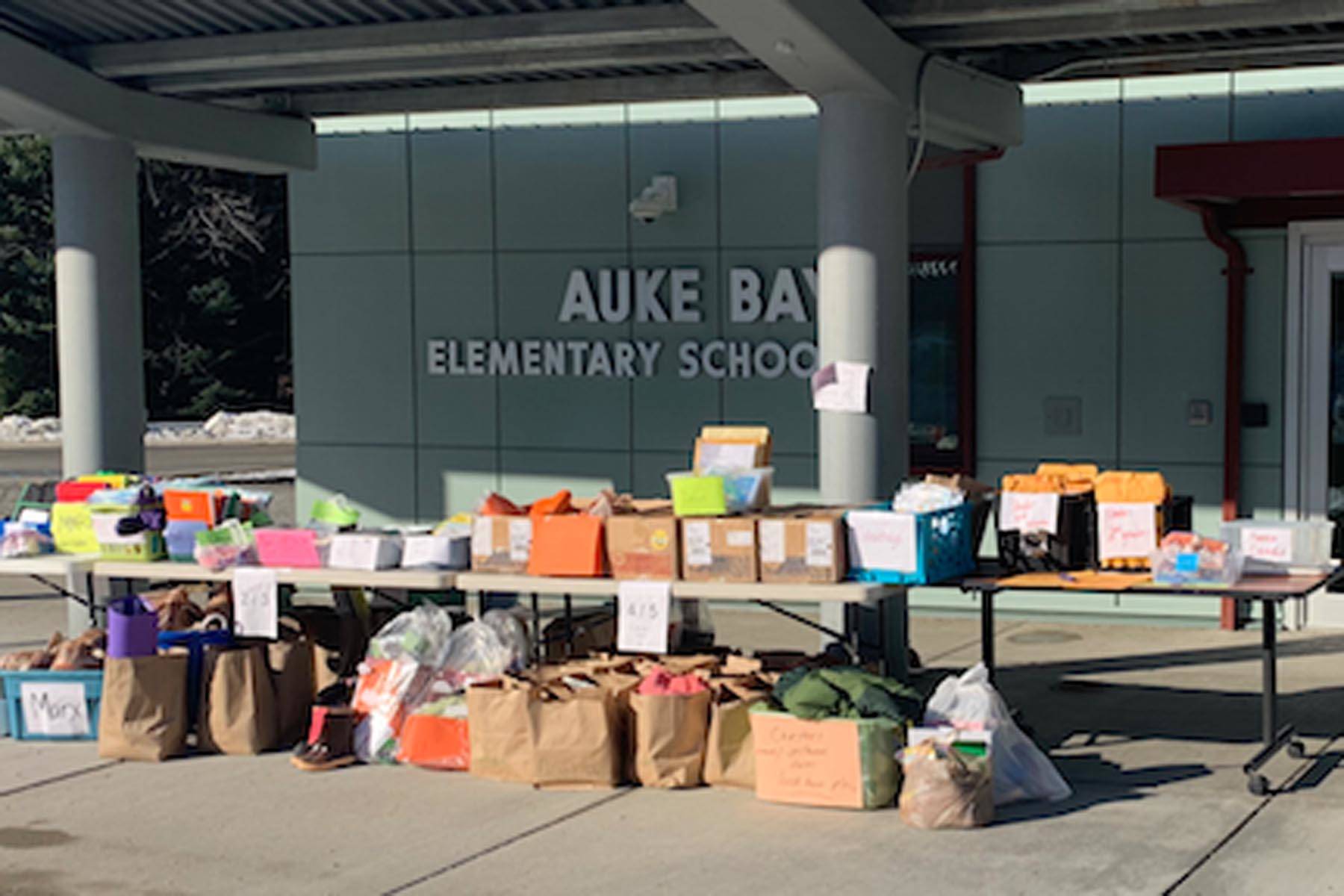 Materials for remote learning are stacked outside Auke Bay Elementary School. (Courtesy photo | Juneau School District)