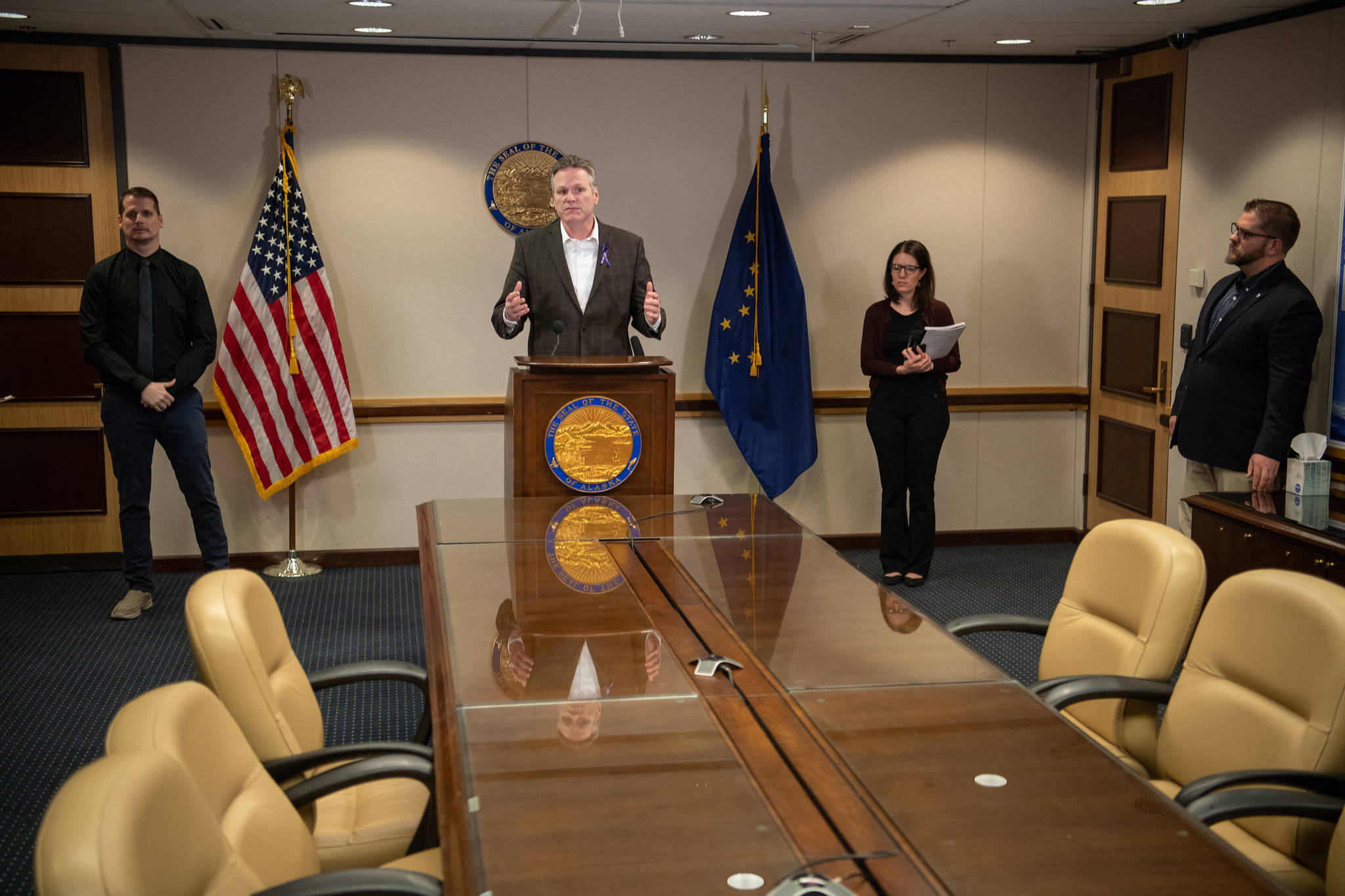Gov. Mike Dunleavy speaks at a press conference in Anchorage with Chief Medical Officer Dr. Anne Zink on Tuesday, March 24, 2020. (Courtesy photo | Office of Gov. Mike Dunleavy)