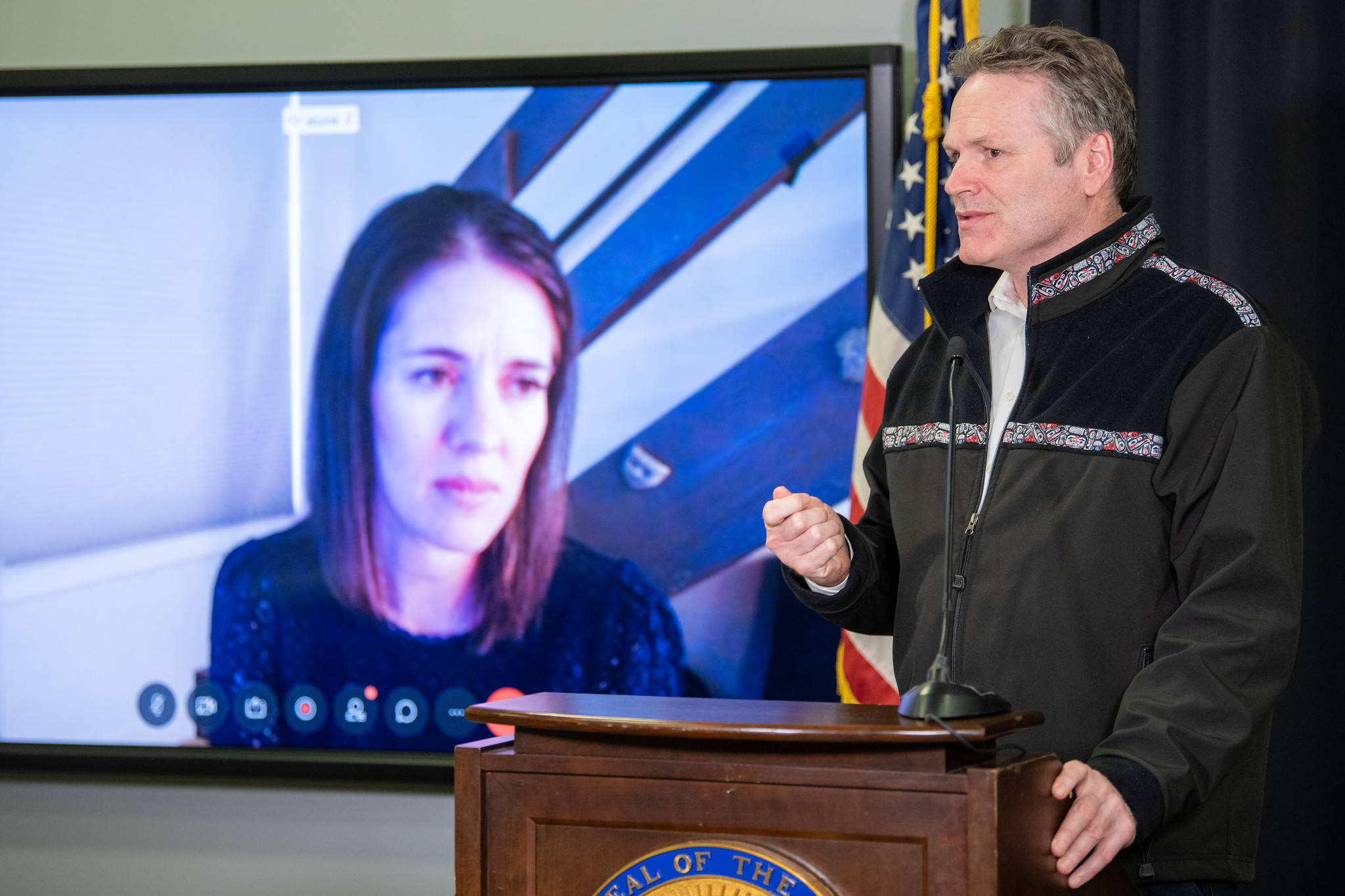 Courtesy photo | Office of Gov. Mike Dunleavy                                 Gov. Mike Dunleavy speaks at a press conference in Anchorage, joined via video by Chief Medical Officer Dr. Anne Zink on Thursday