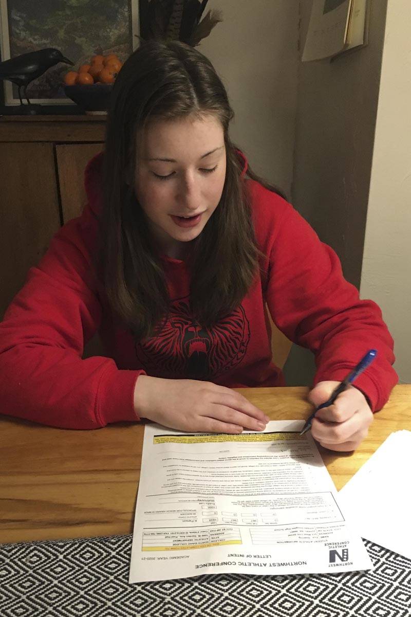 Courtesy photo | Heidi Johnson                                 Eva Goering signs her committement to play college soccer for North Idaho College.