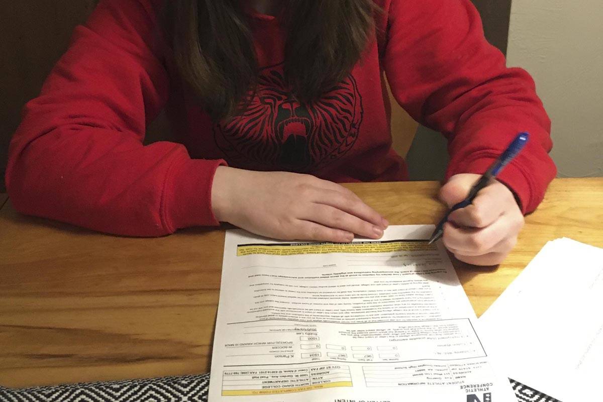Eva Goering signs her committement to play college soccer for North Idaho College. (Courtesy photo | Heidi Johnson)