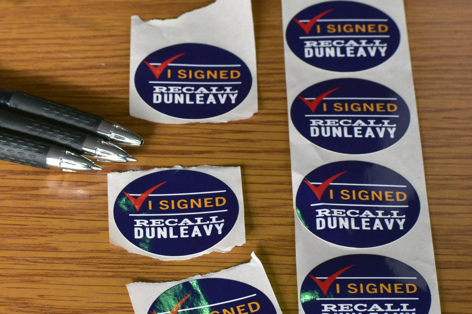 Juneauites gathered signatures to recall Gov. Mike Dunleavy in late February. (Peter Segall | Juneau Empire)