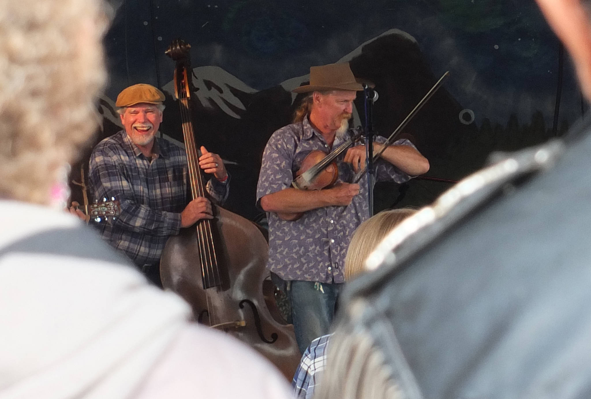 Audience members watch The Fishpickers joke on stage during their performance Saturday, Aug. 1, 2015 at the 47th annual Southeast Alaska State Fair in Haines. (Juneau Empire file)