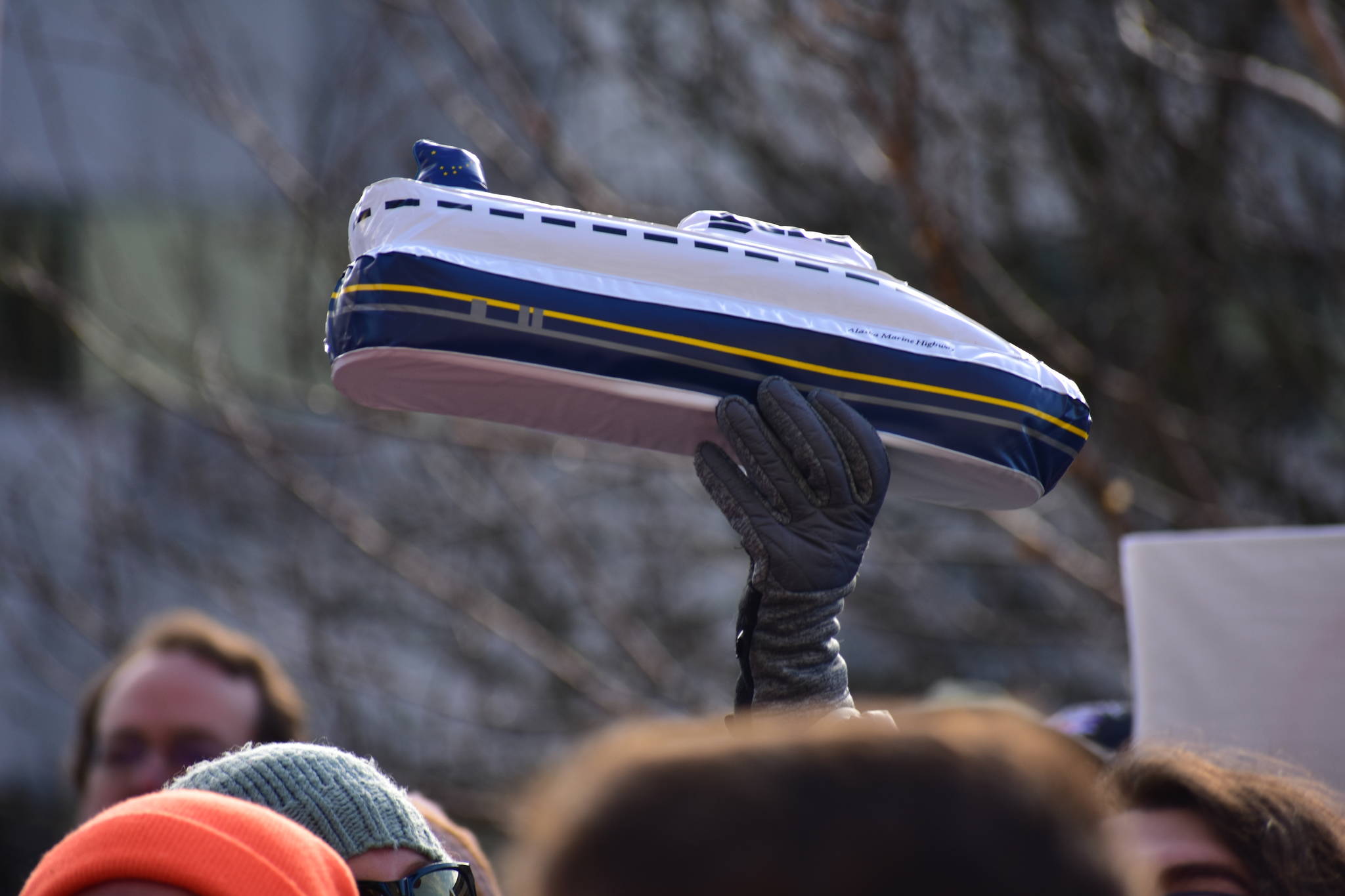 Someone holds up an inflatable Alaska Marine Highway ferry at at a rally to support of the Alaska Marine Highway System on Tuesday, Feb. 11, 2020. (Peter Segall | Juneau Empire File)