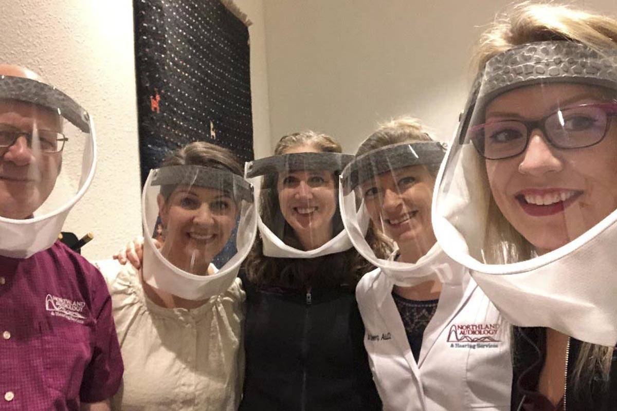 Courtesy photo | Kaia Rongstad                                 Personnel at Northland Audiology and Hearing Services demonstrates a new style of mask that allows the hearing-impared to see the user’s mouth, facilitating communication.