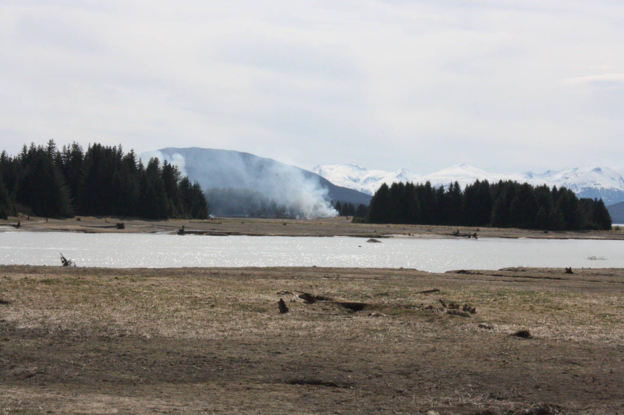 This photo taken near Eagle Beach shows smoke rising from a wildland fire May 9, 2020. (Ben Hohenstatt | Juneau Empire)