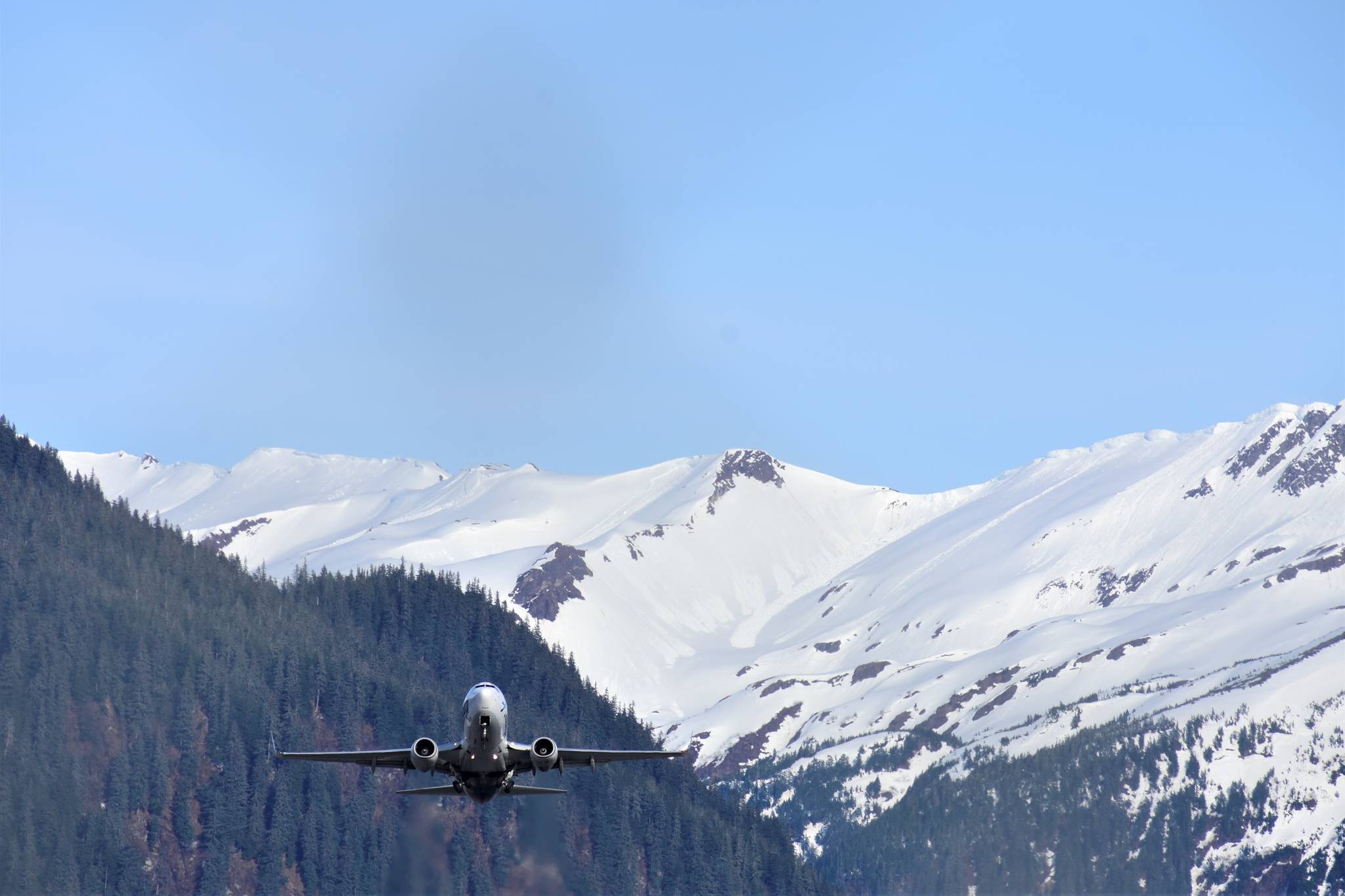 A plane takes off from Juneau International Airport on Thursday. May 7, 2020. City and Borough of Juneau Assembly members have concerns about more travels coming from out of state potentially spreading COVID-19. (Peter Segall | Juneau Empire)