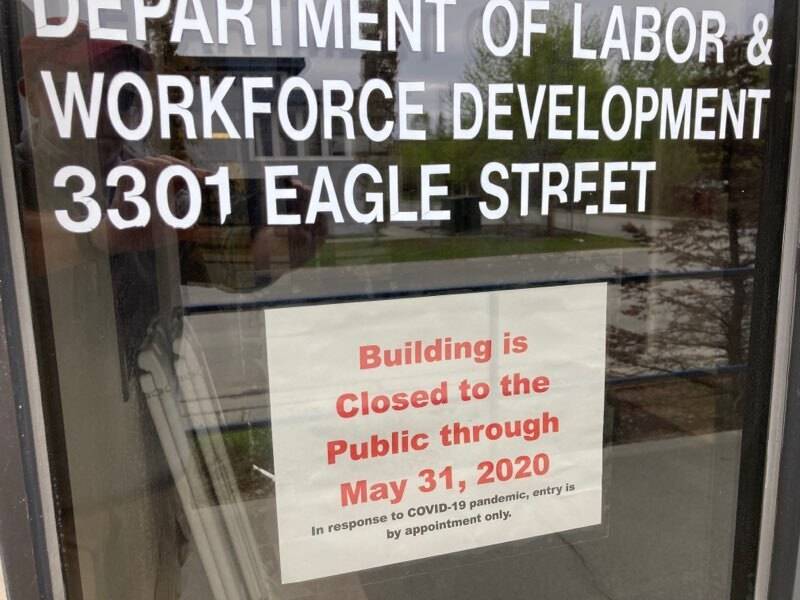 A sign on the door of the state labor department office in Anchorage, Alaska, on Friday, May 22, 2020, shows the office is closed to the public through the end of May. A report released by the department Friday showed the number of jobs in Alaska in April was down sharply compared to April 2019 amid coronavirus concerns. (AP Photo | Mark Thiessen)
