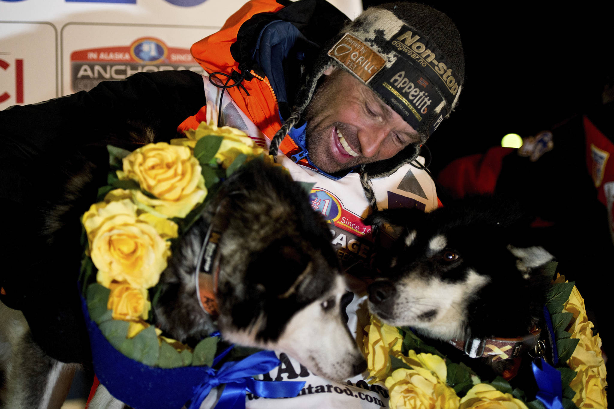 Thomas Waerner, of Norway, celebrates in Nome his win in the Iditarod Trail Sled Dog Race. Waerner is still waiting to return to his home in Norway. Waerner and his 16 dogs have been stranded in Alaska by travel restrictions and flight cancellations caused by the coronavirus pandemic. (Marc Lester | Anchorage Daily News via AP, File)