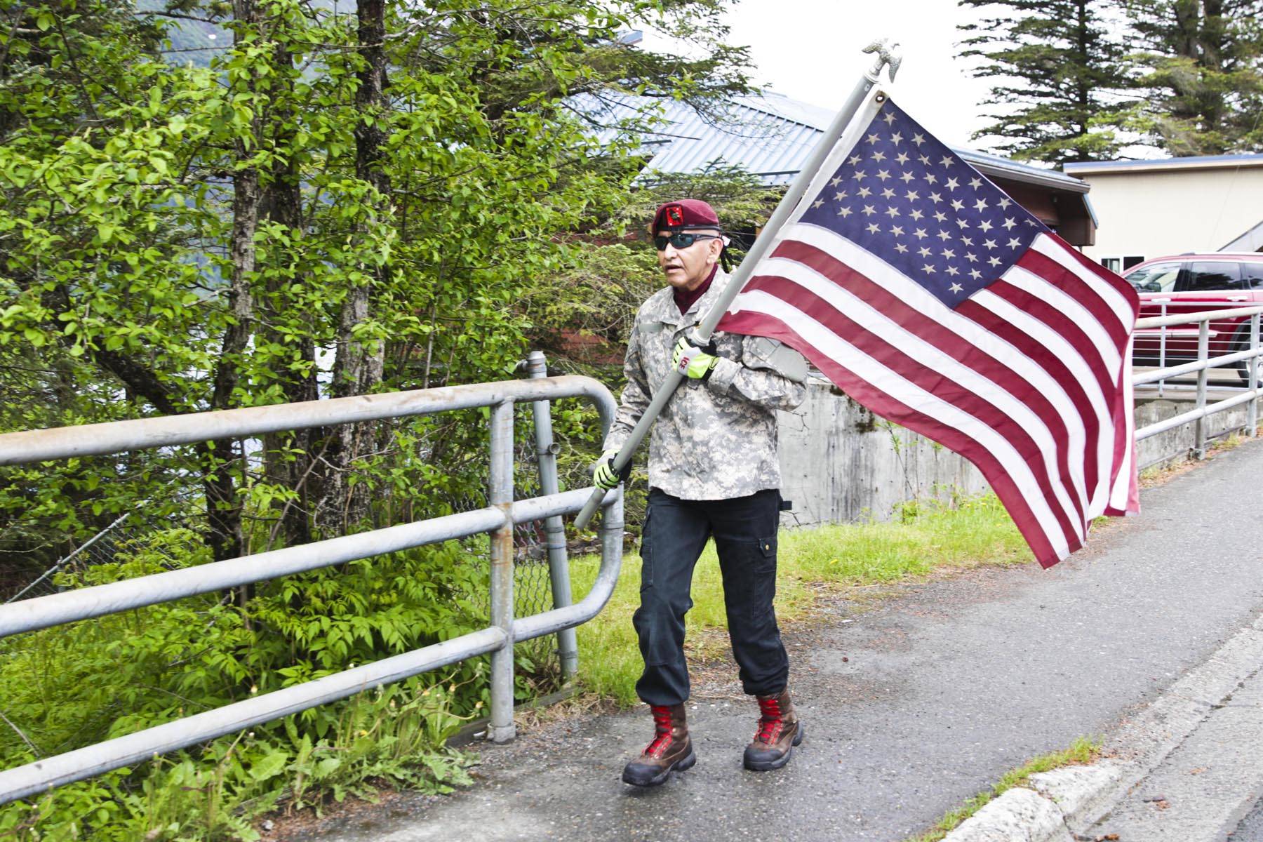 Michael S. Lockett | Juneau Empire                                 Henry Williams runs from Douglas to the Mendenhall Valley on Memorial Day to honor dead service members, including his relative, Air Force Tech Sgt. Leslie Dominic Williams, who died in Afghanistan in 2011.