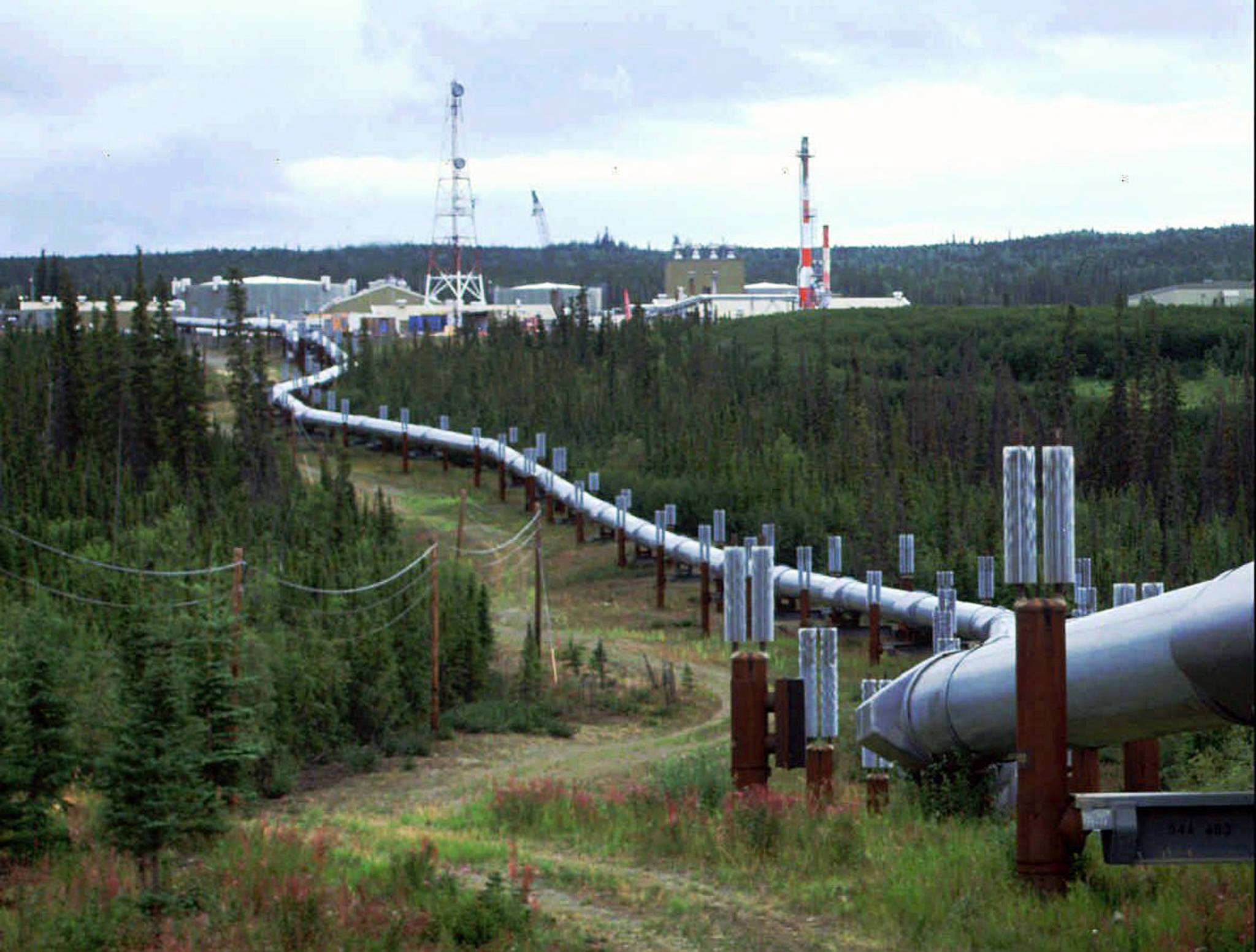This undated file photo shows the Trans-Alaska pipeline and pump station north of Fairbanks, Alaska. The future of Alaska’s unique program of paying residents an annual check is in question, with oil prices low and an economy struggling during the coronavirus pandemic. (AP Photo | Al Grillo, File)