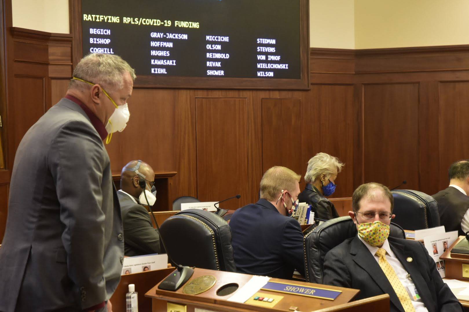 Sen. Mike Shower, R-Wasilla, speaks about ratifying Gov. Mike Dunleavy’s appropriations of federal funds Tuesday, May 19, 2020, while Sen. Jesse Kiehl, D-Juneau, listens. (Peter Segall | Juneau Empire)