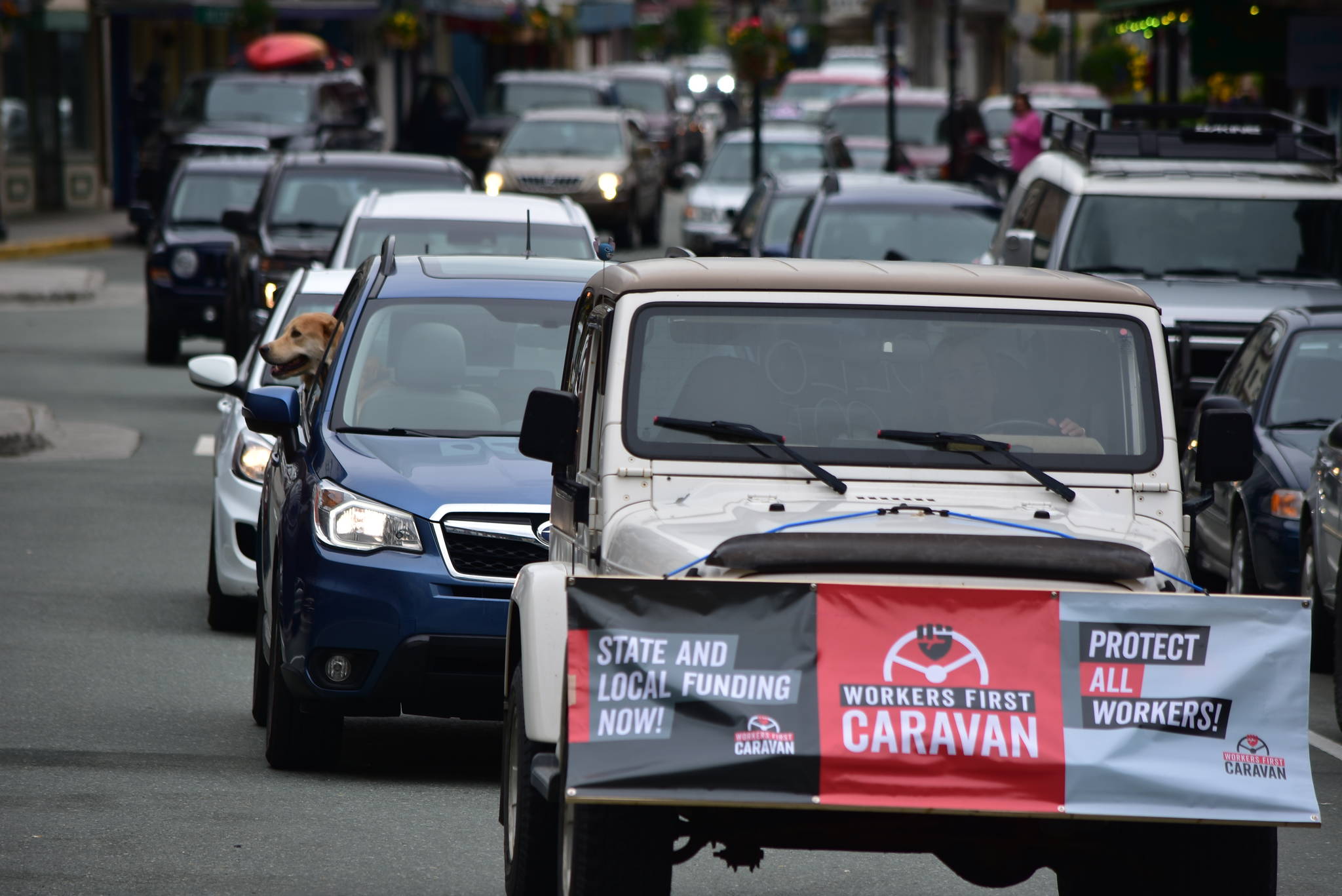 A caravan of union workers and their supporters drive through downtown Juneau on Wednesday, June 17, 2020, as part of a nation protest in support of workers during the COVID-19 pandemic. (Peter Segall | Juneau Empire)