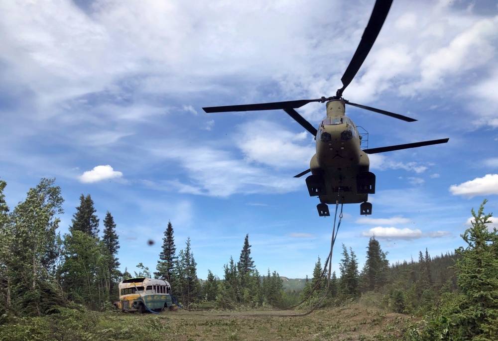 Alaska Army National Guard Soldiers assigned to 1st Battalion, 207th Aviation Regiment execute an extraction mission via a CH-47 Chinook helicopter over Healy, Alaska, June 18, 2020. As part of a combined effort with the Department of Natural Resources, the Guardsmen rigged and airlifted “Bus 142,” known from book and film, “Into the Wild”, out of its location on Stampede Road in light of public safety concerns. (Courtesy photo | Alaska National Guard )