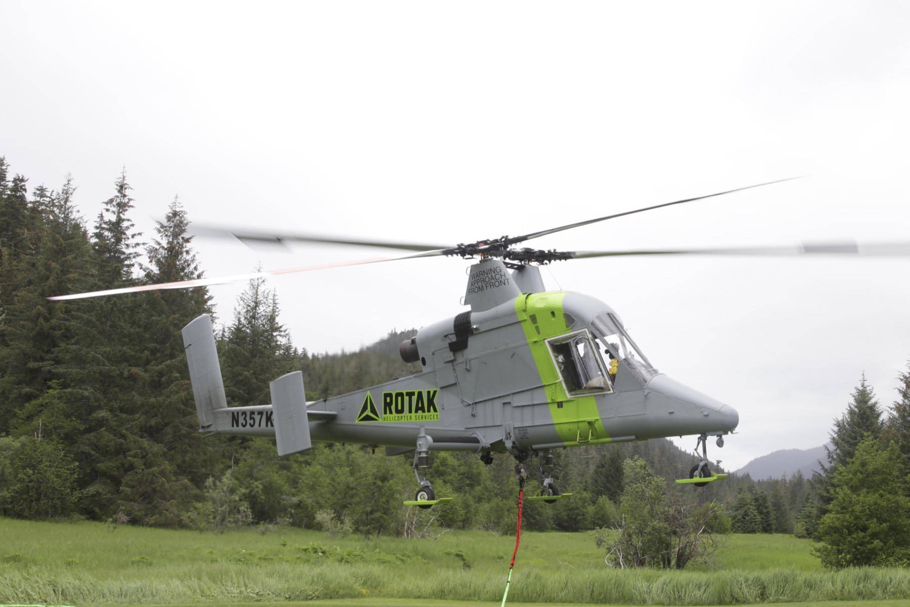 Trail Mix Inc. contracted with ROTAK Helicopter Services to provide a K-Max heavy lift helicopter to slingload dozens of tons of gravels for new construction on the Horse Tram Trail on Tuesday, June 23, 2020. (Michael S. Lockett | Juneau Empire)