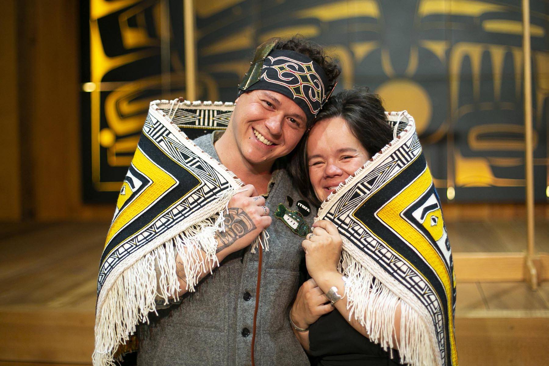 Lily Hope and Ricky Tagaban display the robe they collaborated to weave at its First Dance ceremony at the Sealaska Heritage Institute on Monday, June 22, 2020. (Courtesy photo | Annie Bartholomew)