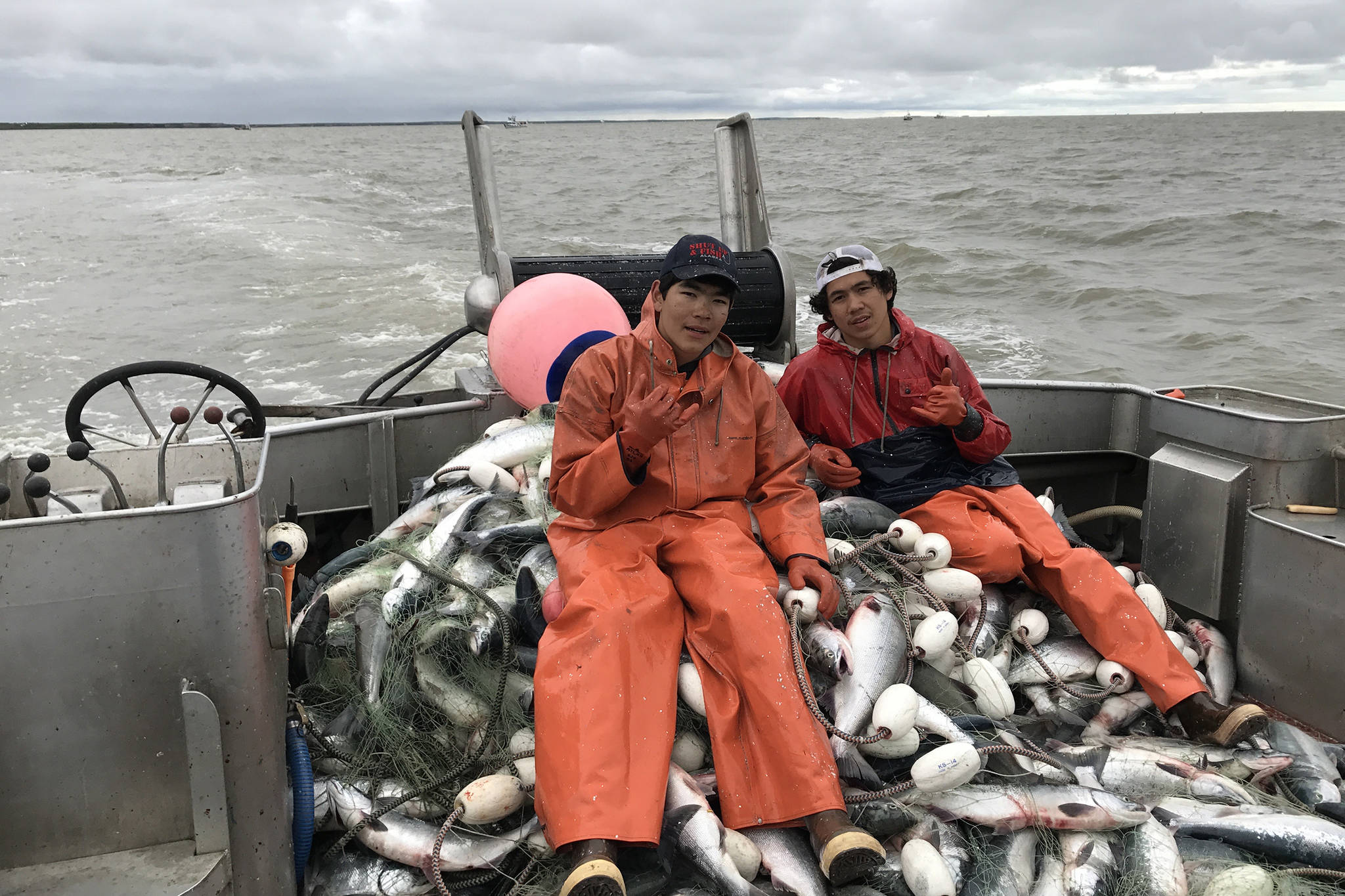 Triston Chaney and his brother sit aboard their grandpa’s gill-netter in Bristol Bay. (Courtesy Photo | Triston Chaney)