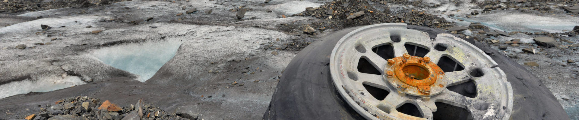 Landing gear from a 1952 C-124 Globemaster II aircraft accident rests on top of Colony Glacier June 10, 2015. Each summer since 2012 Alaskan Command has supported Operation Colony Glacier by removing aircraft debris and assisting in the recovery of human remains to ensure closure for families who have lost loved ones. (U.S. Air Force photo | Tech. Sgt. John Gordinier)