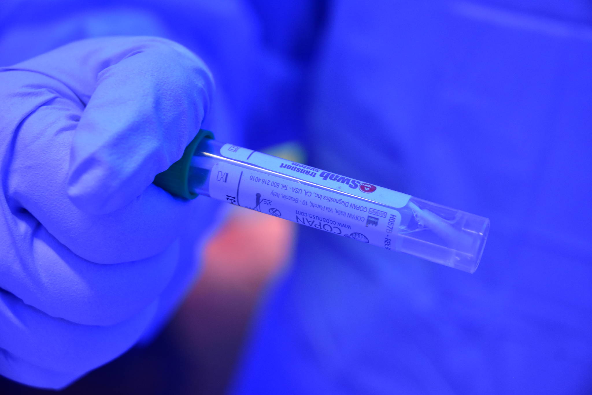 Capital City Fire/Rescue firefighter/EMT Jessica Skiba holds a COVID-19 test sample at the citys drive-thru screening site at the Hagevig Regional Fire Training Center in the Mendenhall Valley on Monday, June 29, 2020. (Peter Segall | Juneau Empire)