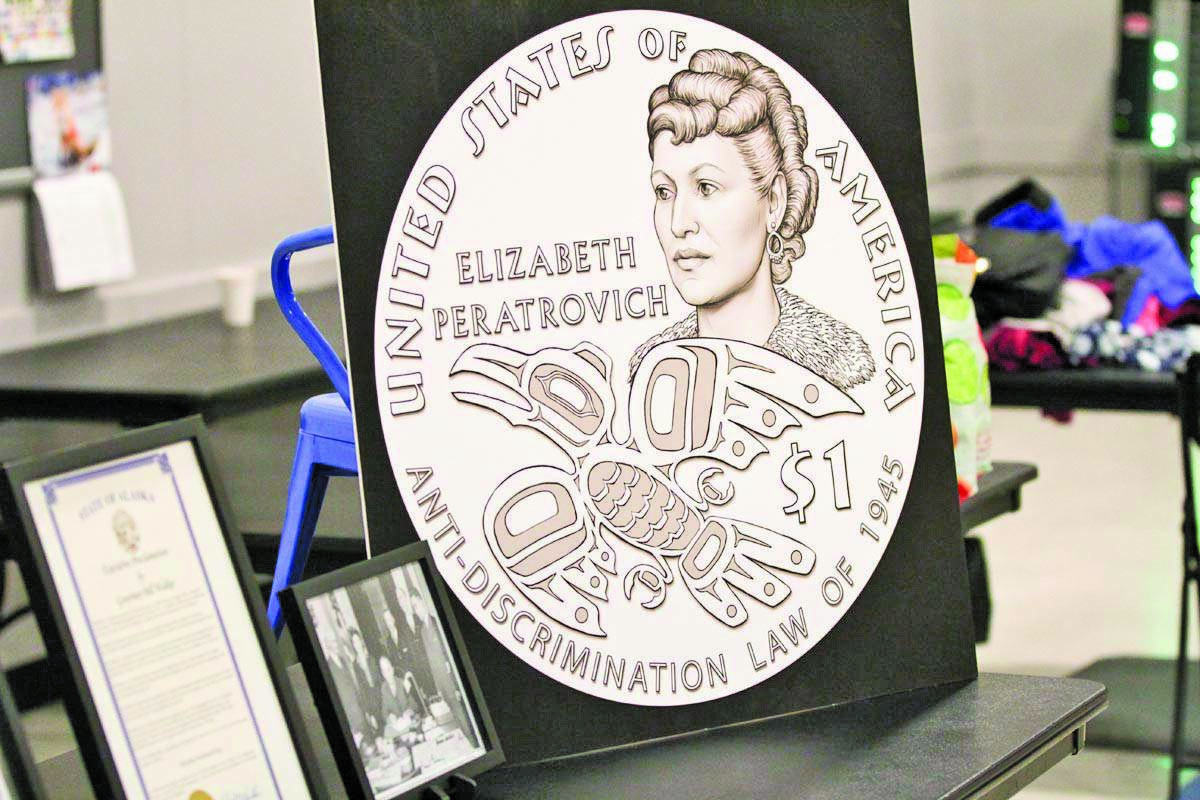The design for the new gold $1 Elizabeth Peratrovich coin was on display during the Elizabeth Peratrovich Day celebration at the Tlingit and Haida Community Council on Feb. 16, 2020. The U.S. Mint is making the coin available to Alaska financial institutions. (Michael S. Lockett | Juneau Empire File)
