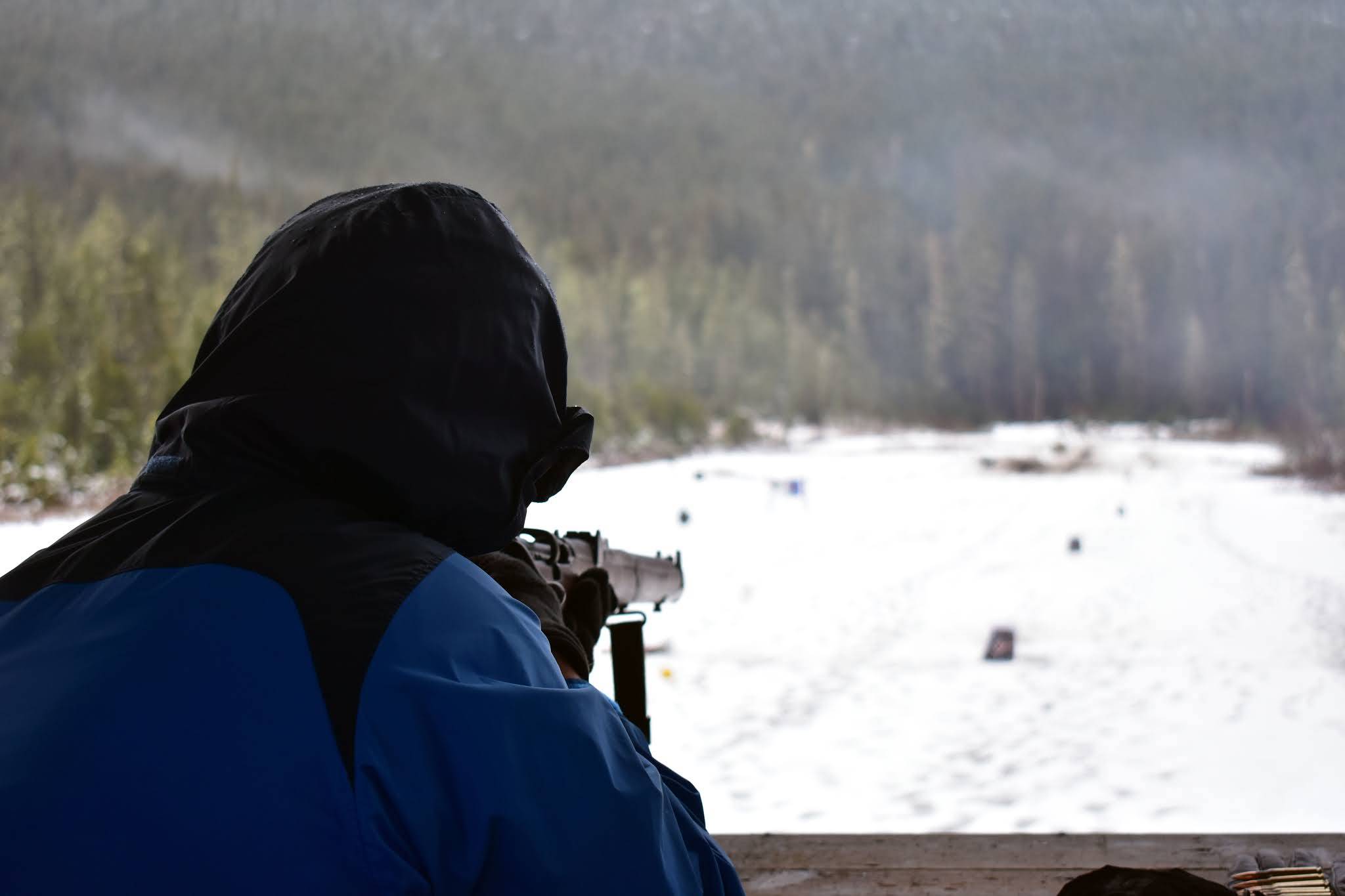 Nolin Ainsworth sights down an Ishapore 2A1 rifle at the Hank Harmon Rifle Range, Dec. 1, 2019. The range will be closed Monday and Tuesday as the brush around the perimeter is cleared by the COVID-19 Conservation Corps. (Peter Segall | Juneau Empire)