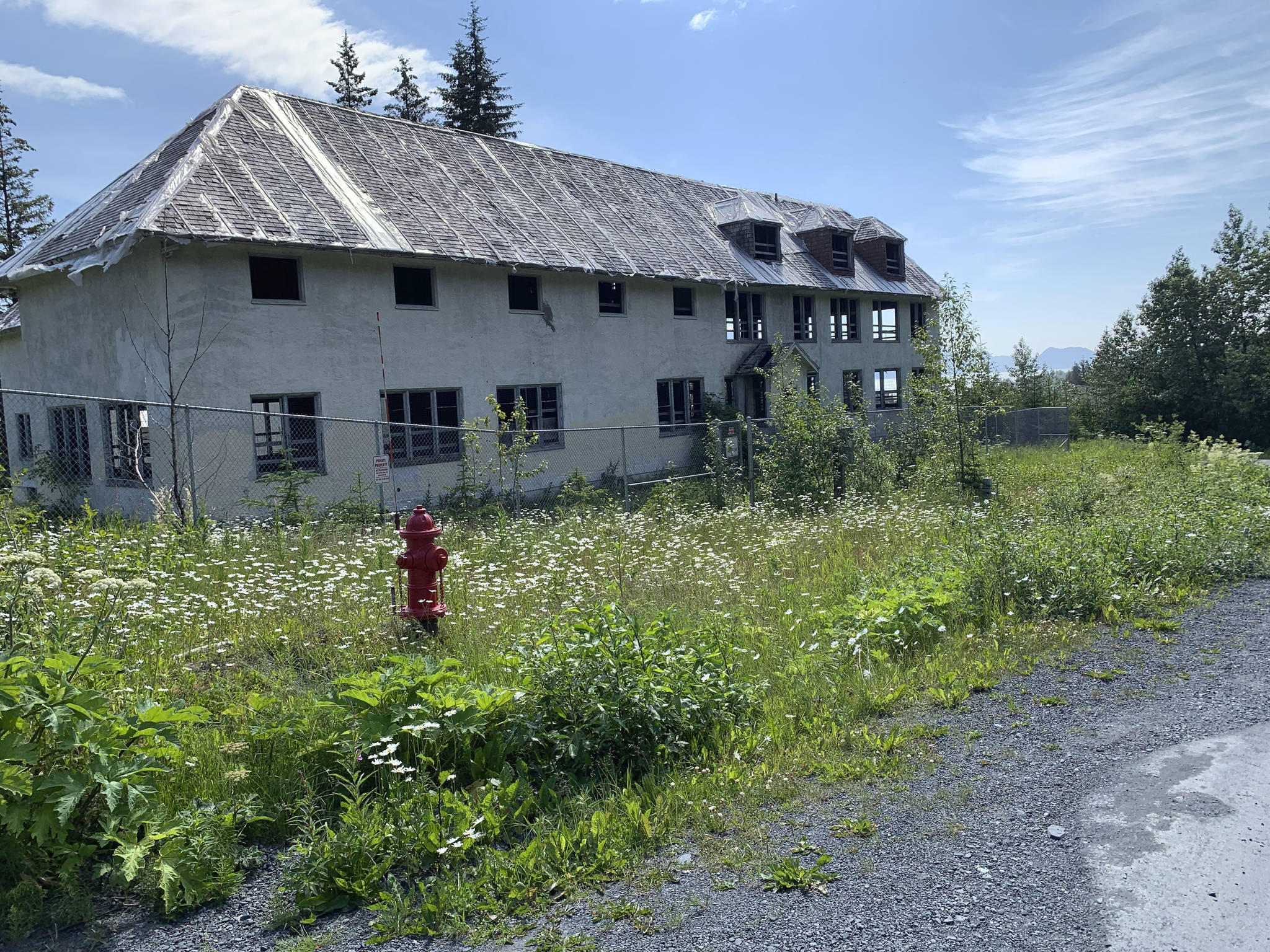 This undated photo shows a building that remains at the site of the Jesse Lee Home in Seward, Alaska, where the territorial flag, which later became the Alaska state flag, was first flown.The neglected site where the Alaska territorial flag was designed, sewn and first flown will be demolished despite last-minute efforts by Alaskans and a preservation group to save it. The Seward City Council voted Monday, July 13, 2020, to raze the Jesse Lee Home. (Trish Neal via AP, File)