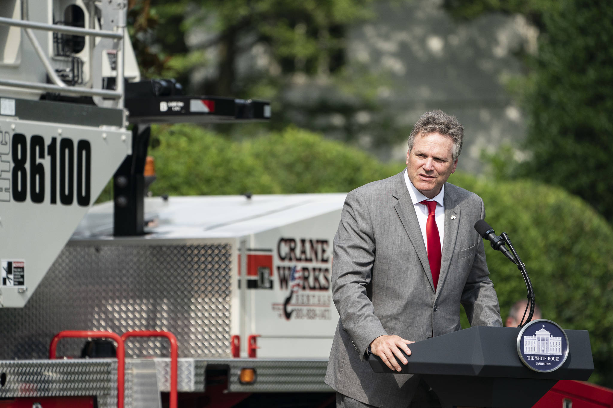 President Donald Trump listens as Alaska Governor Mike Dunleavy delivers remarks at the Rolling Back Regulations to Help All Americans event Thursday, July 16, 2020, on the South Lawn of the White House. (Official White House Photo | Joyce N. Boghosian)