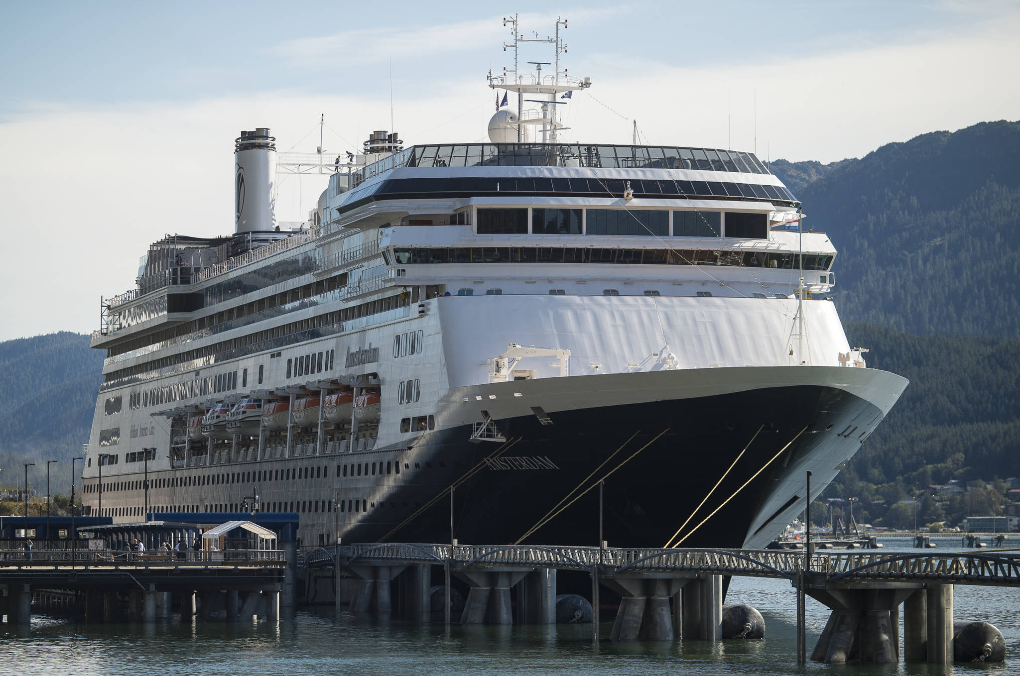 In this Sept. 11, 2018 photo, the Holland America Line ship Amsterdam sits at port in Juneau. Holland America is selling the Amsterdam, Maasdam, Rotterdam and Veendam, which reduces its fleet to 10, the company said. (Michael Penn | Juneau Empire File)