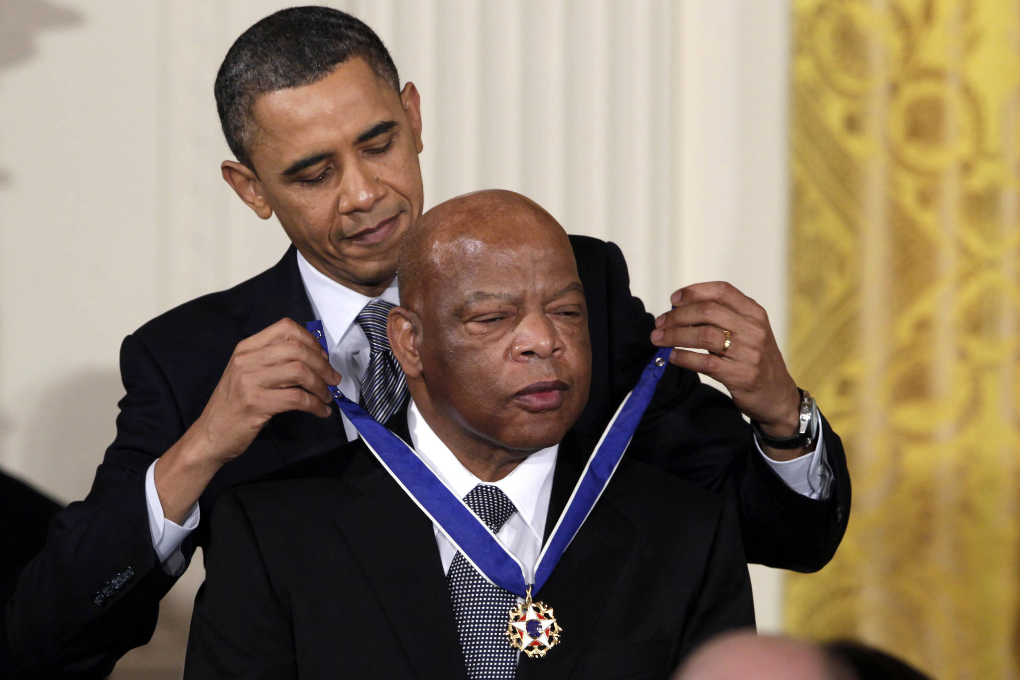 In this February 2011 photo, then-President Barack Obama presents a 2010 Presidential Medal of Freedom to U.S. Rep. John Lewis, D-Ga., during a ceremony in the East Room of the White House in Washington. Lewis, who carried the struggle against racial discrimination from Southern battlegrounds of the 1960s to the halls of Congress, died Friday, July 17, 2020. (AP Photo/Carolyn Kaster, File)
